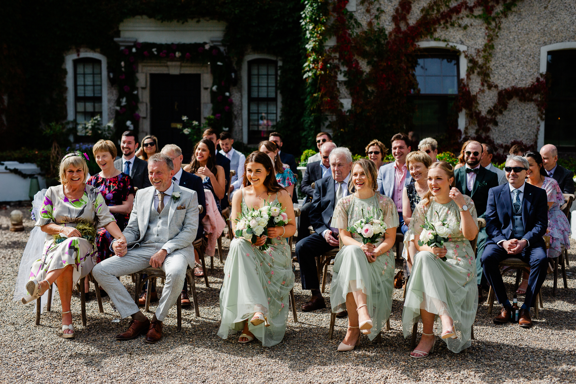 A group of people sitting outside