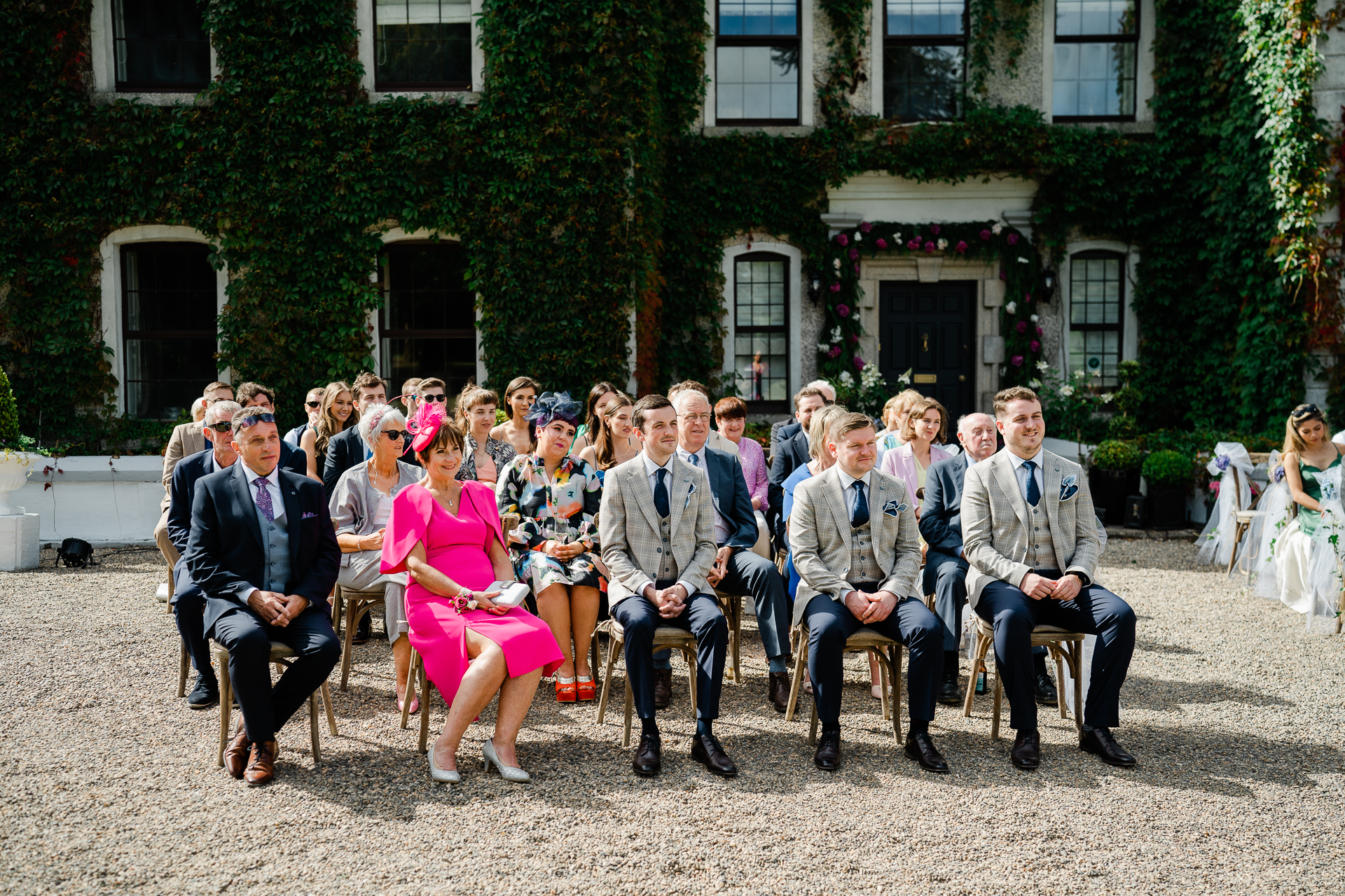 A group of people sitting outside