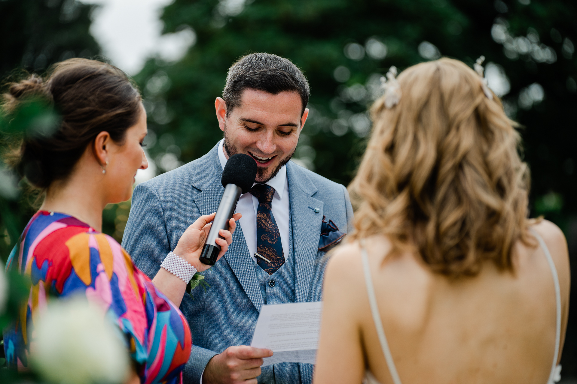 A person speaking into a microphone