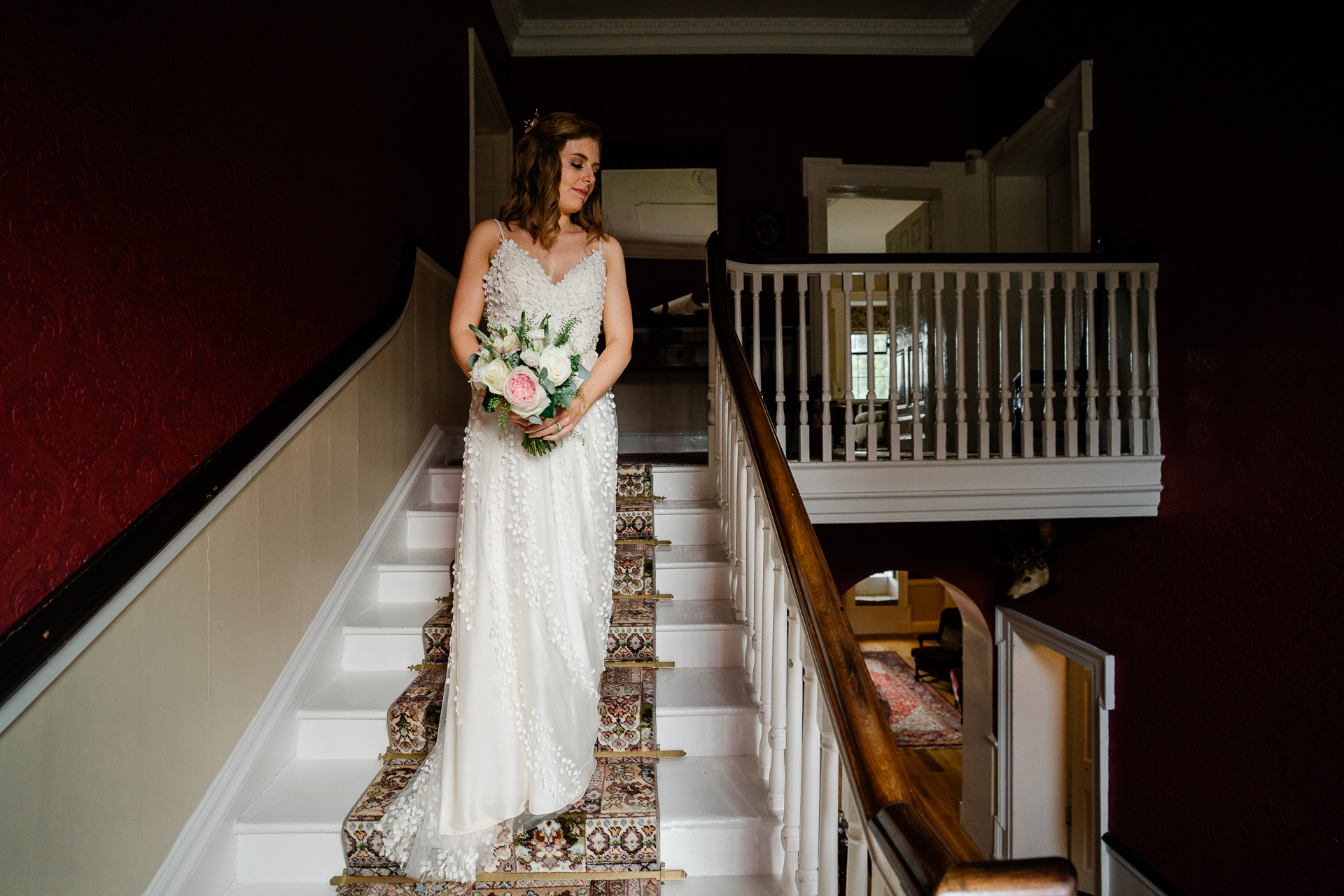 A person in a wedding dress on a staircase