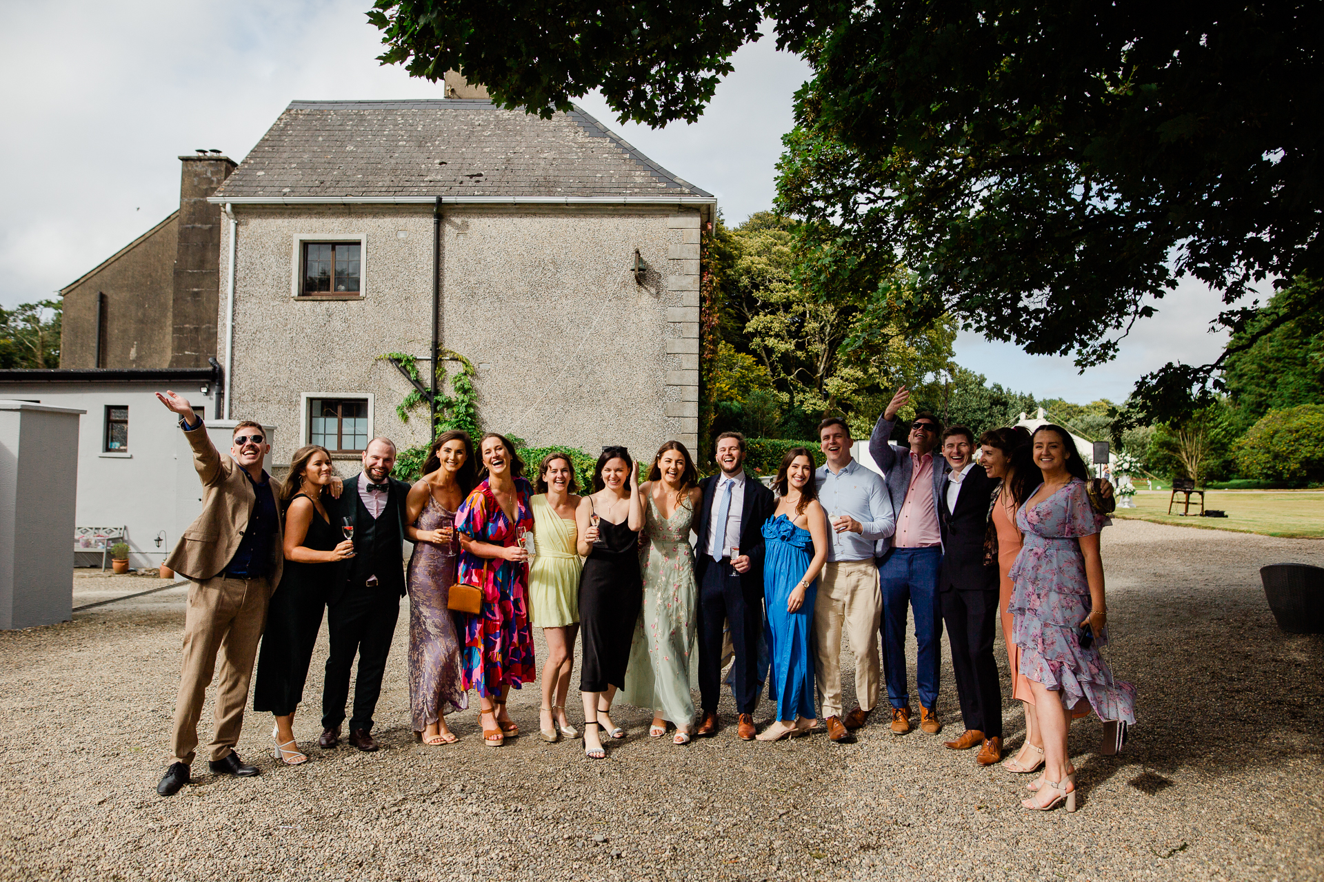 A group of people posing for a photo in front of a building