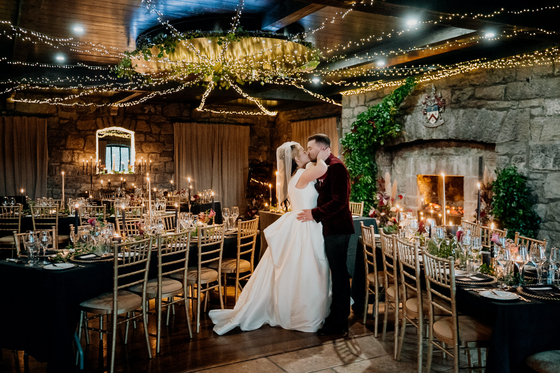 A man and woman in a room with tables and chairs