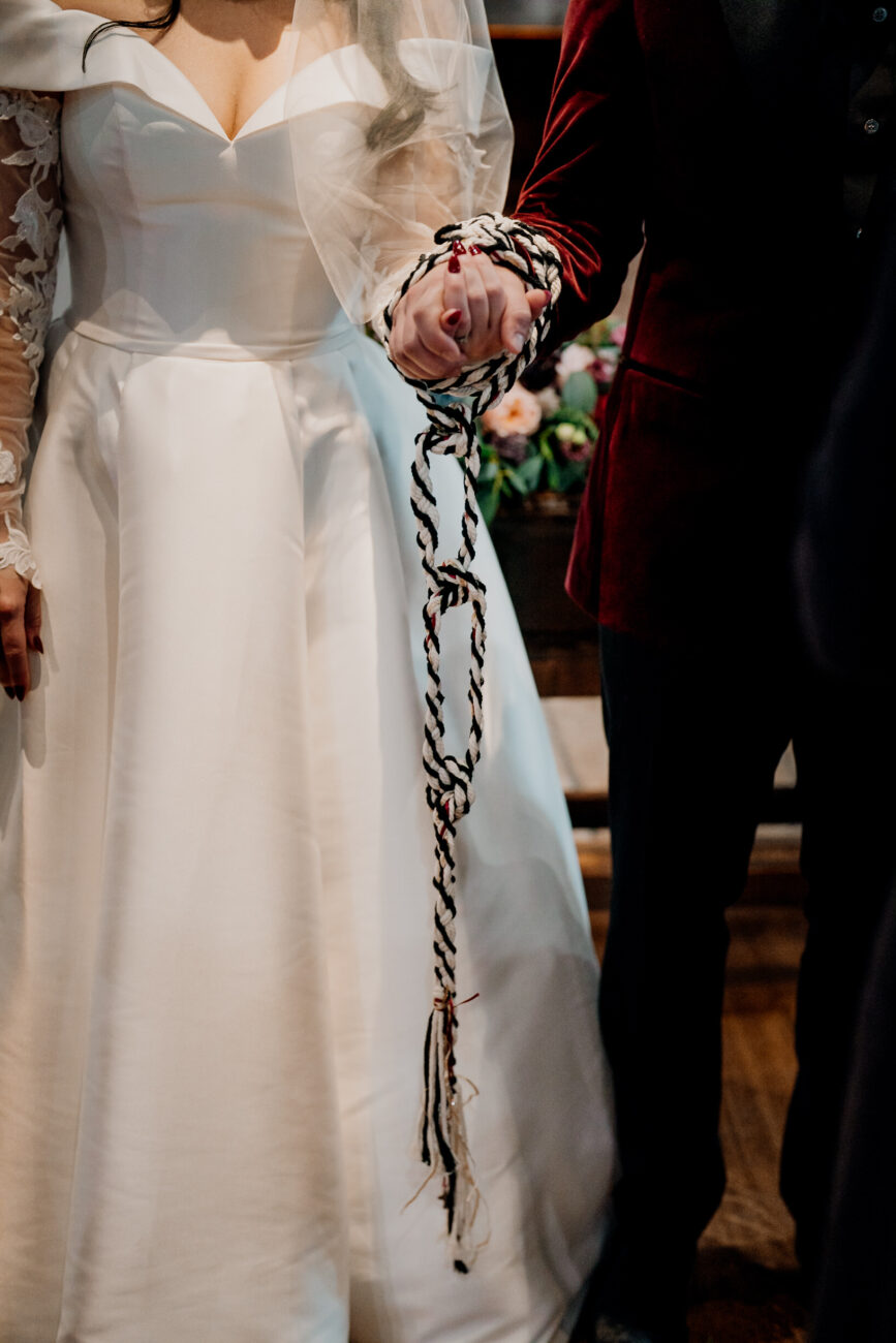 A woman in a white dress and a man in a suit