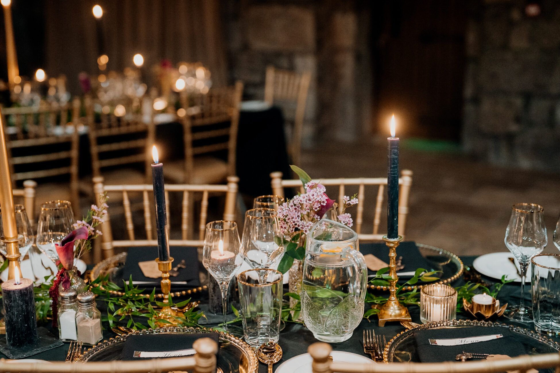 A table with candles and glasses