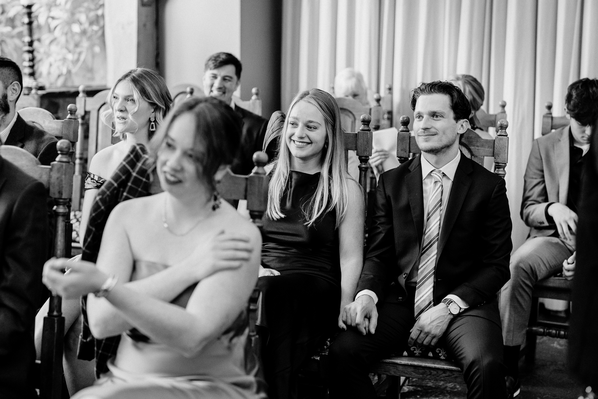 A group of people sitting in chairs