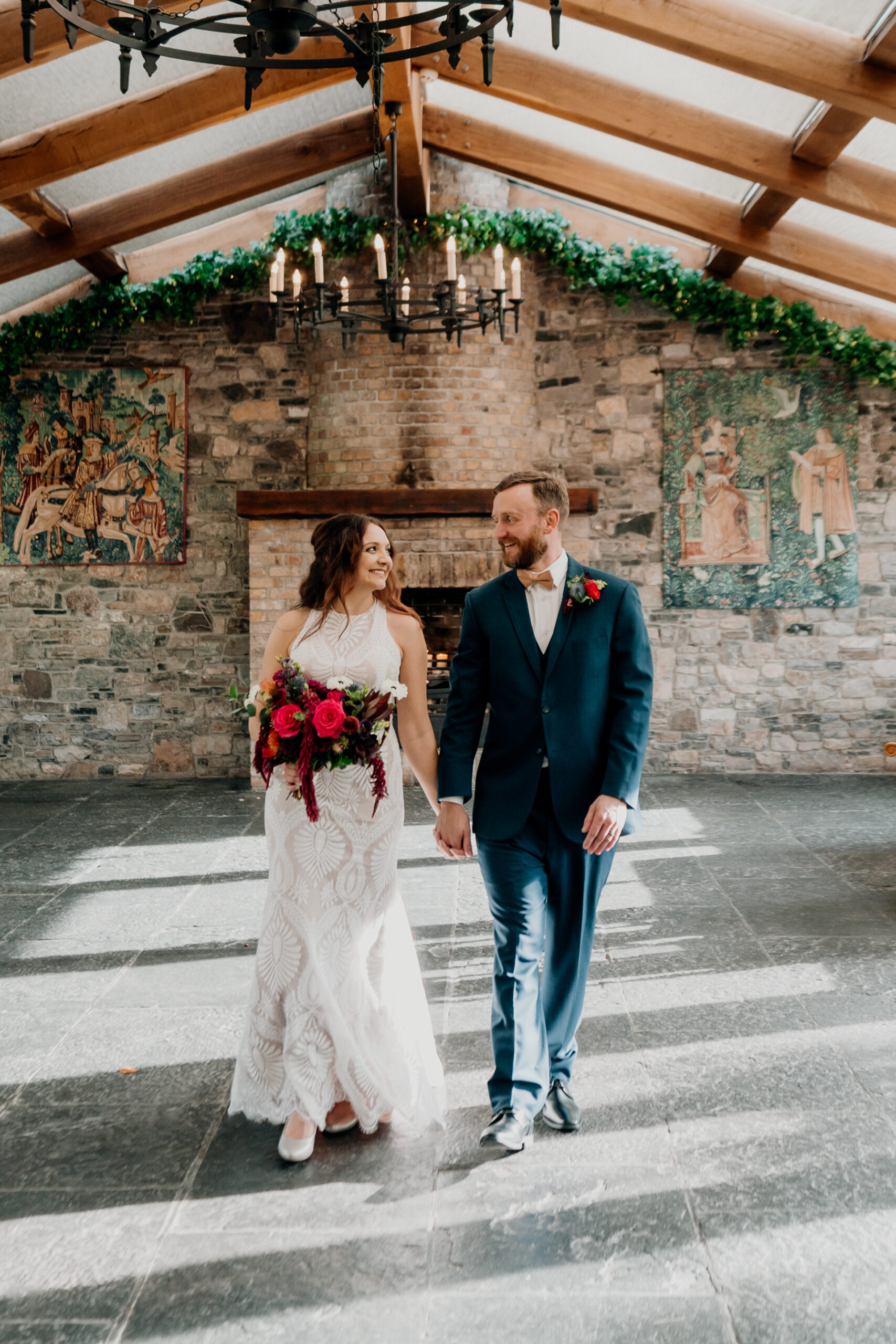 A man and woman walking down a sidewalk