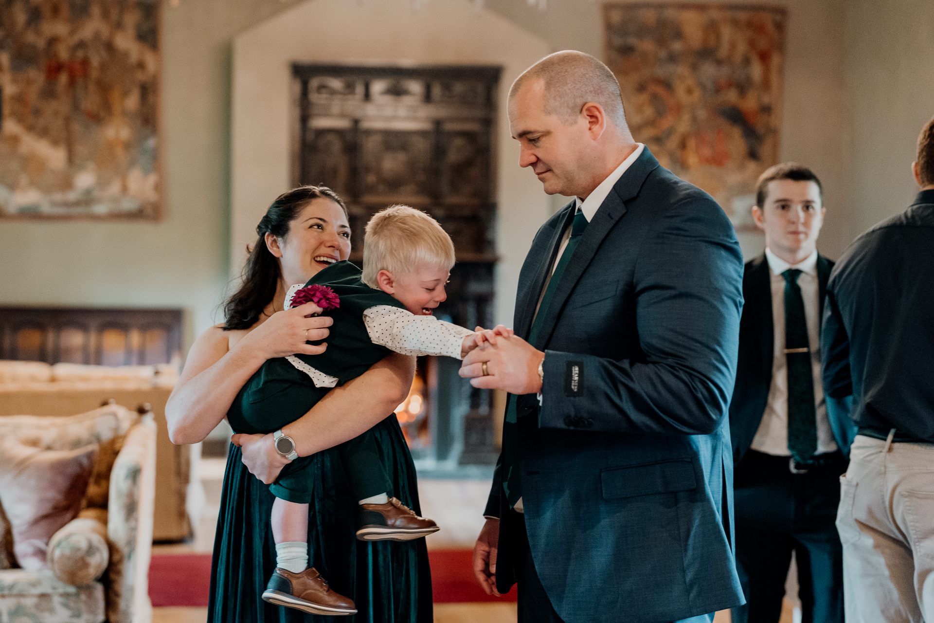 A man and woman holding a baby