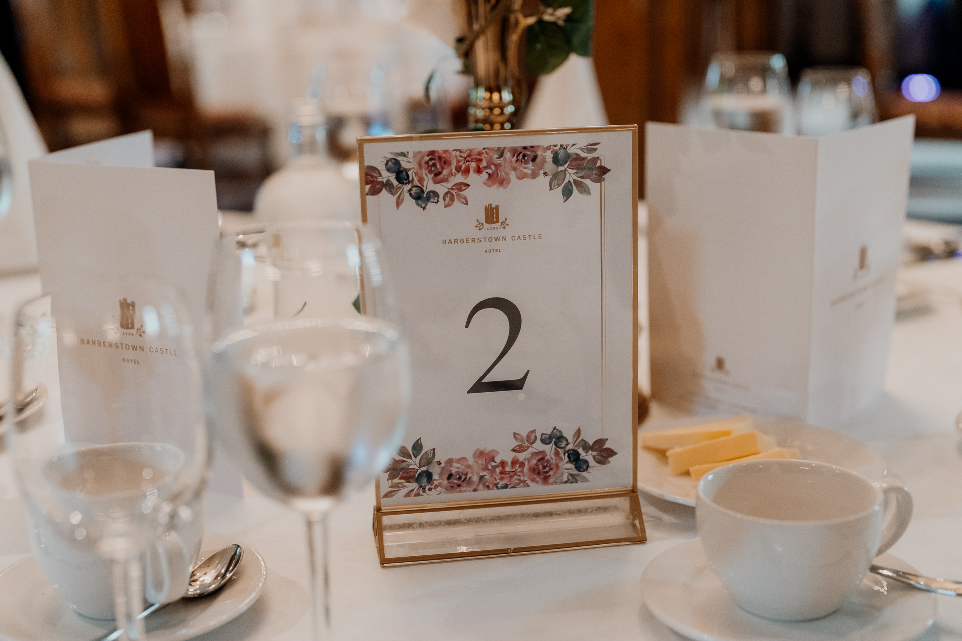 A table with glasses and a sign