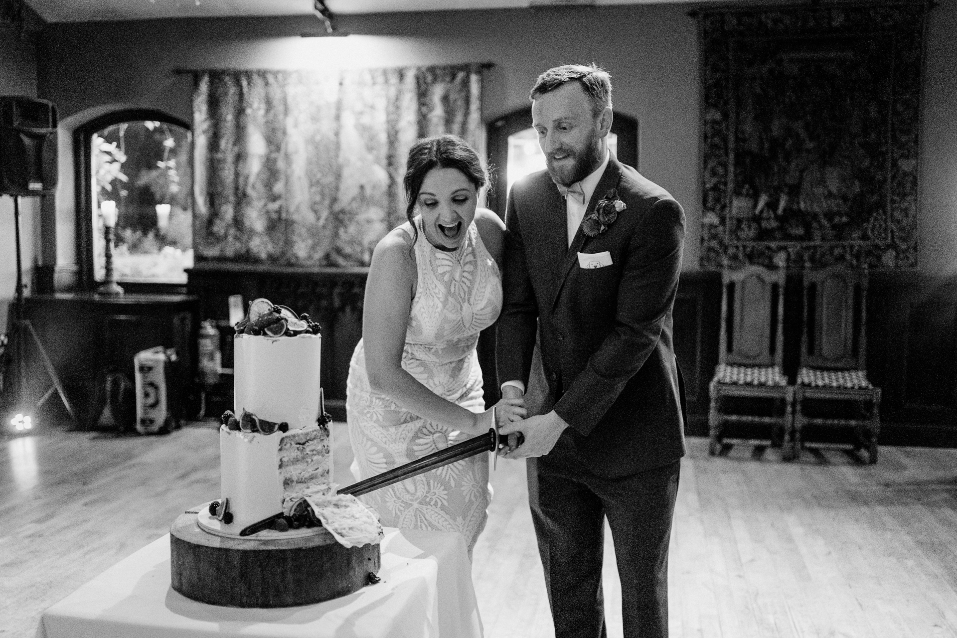 A bride and groom cutting a wedding cake