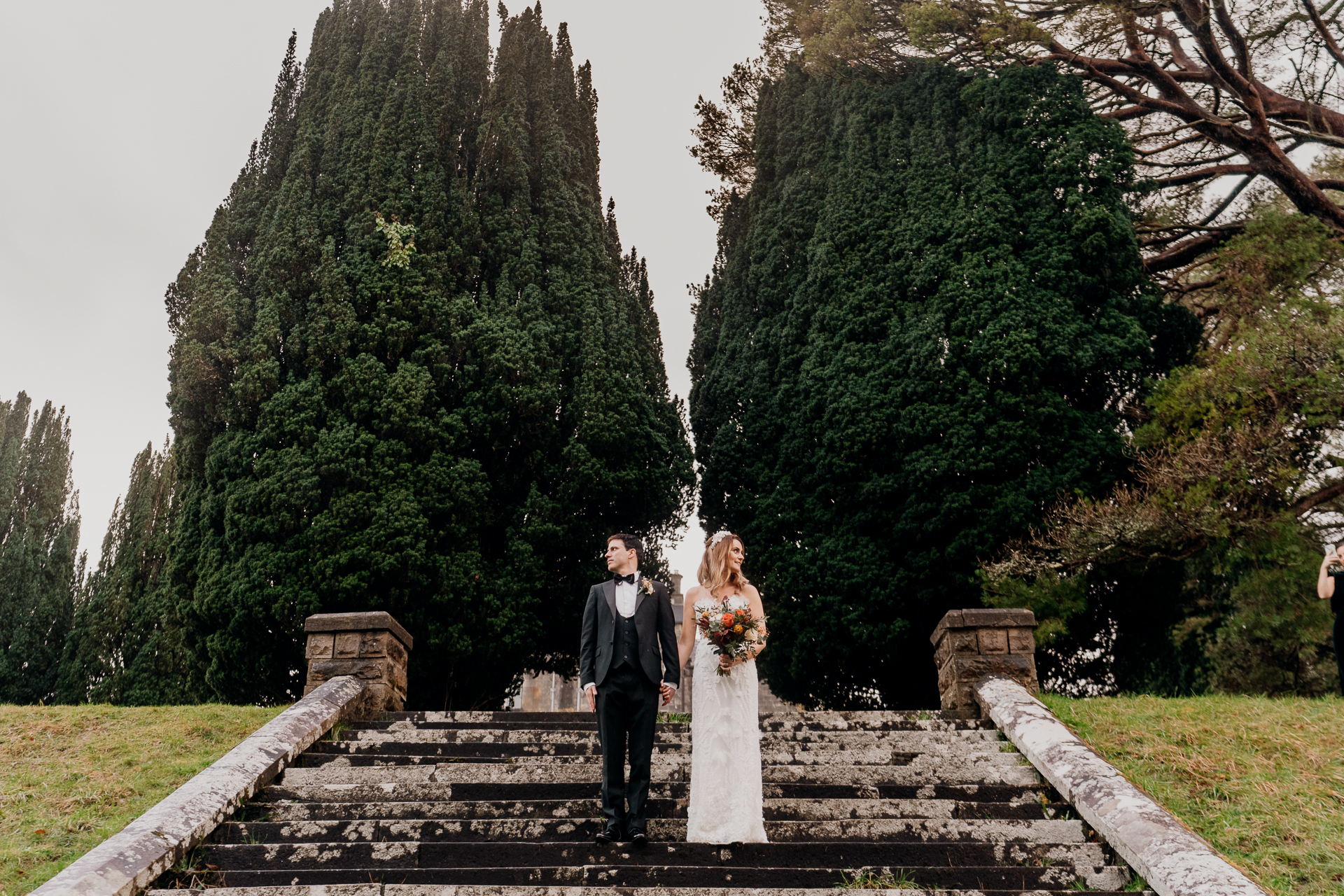 A man and woman posing for a picture on stairs