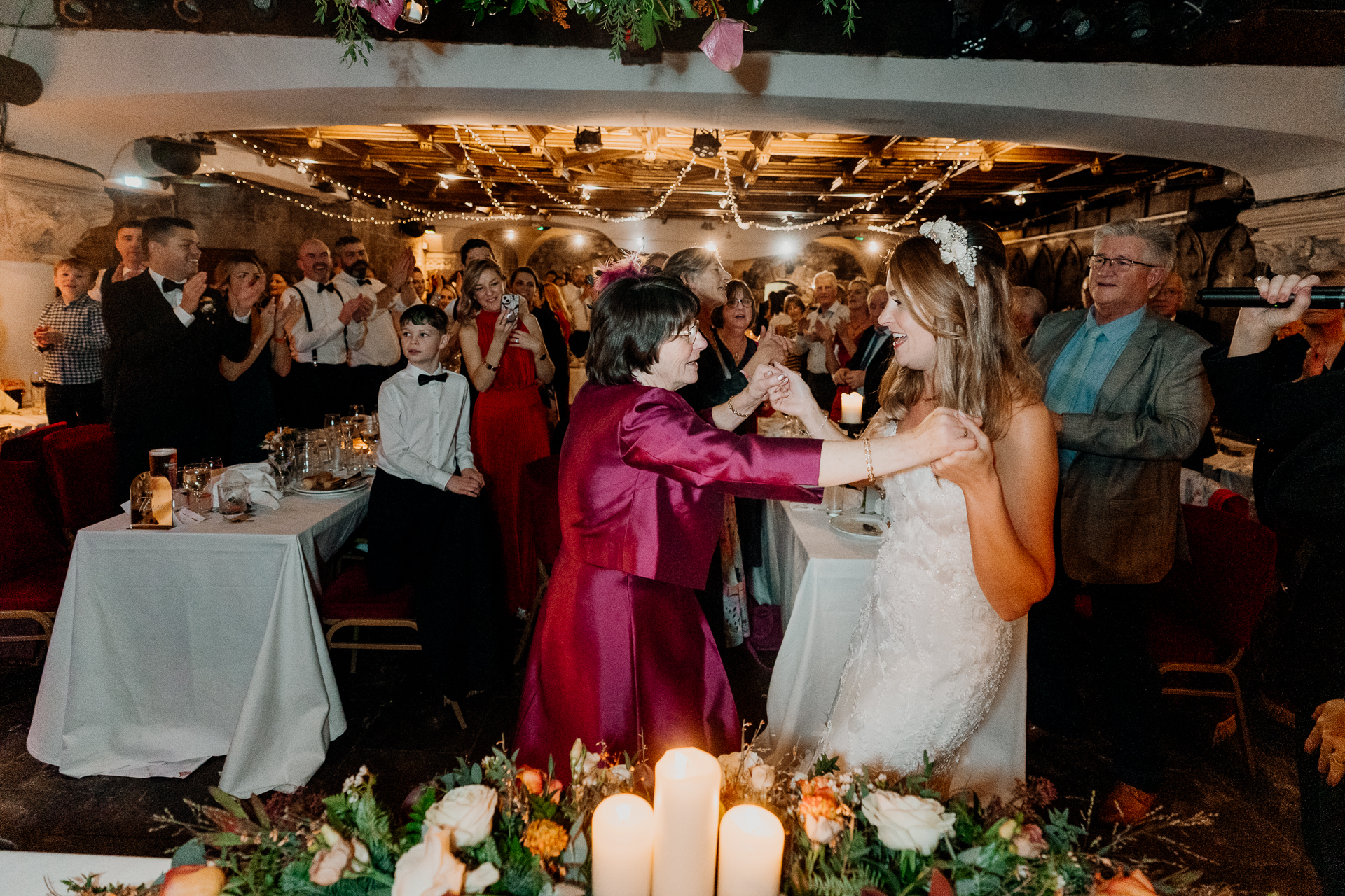 A man and woman dancing at a wedding reception