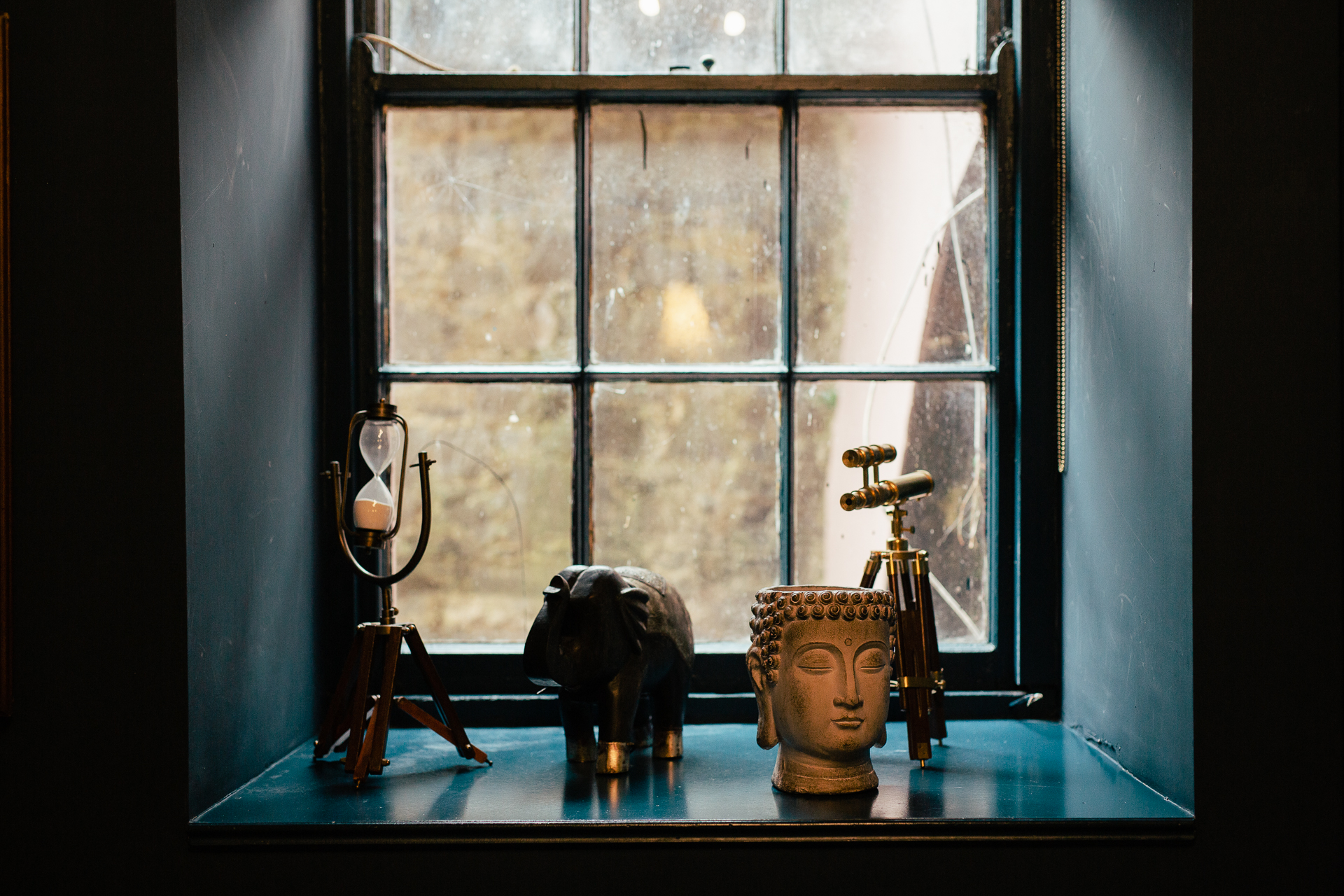 A couple of vases sit on a counter