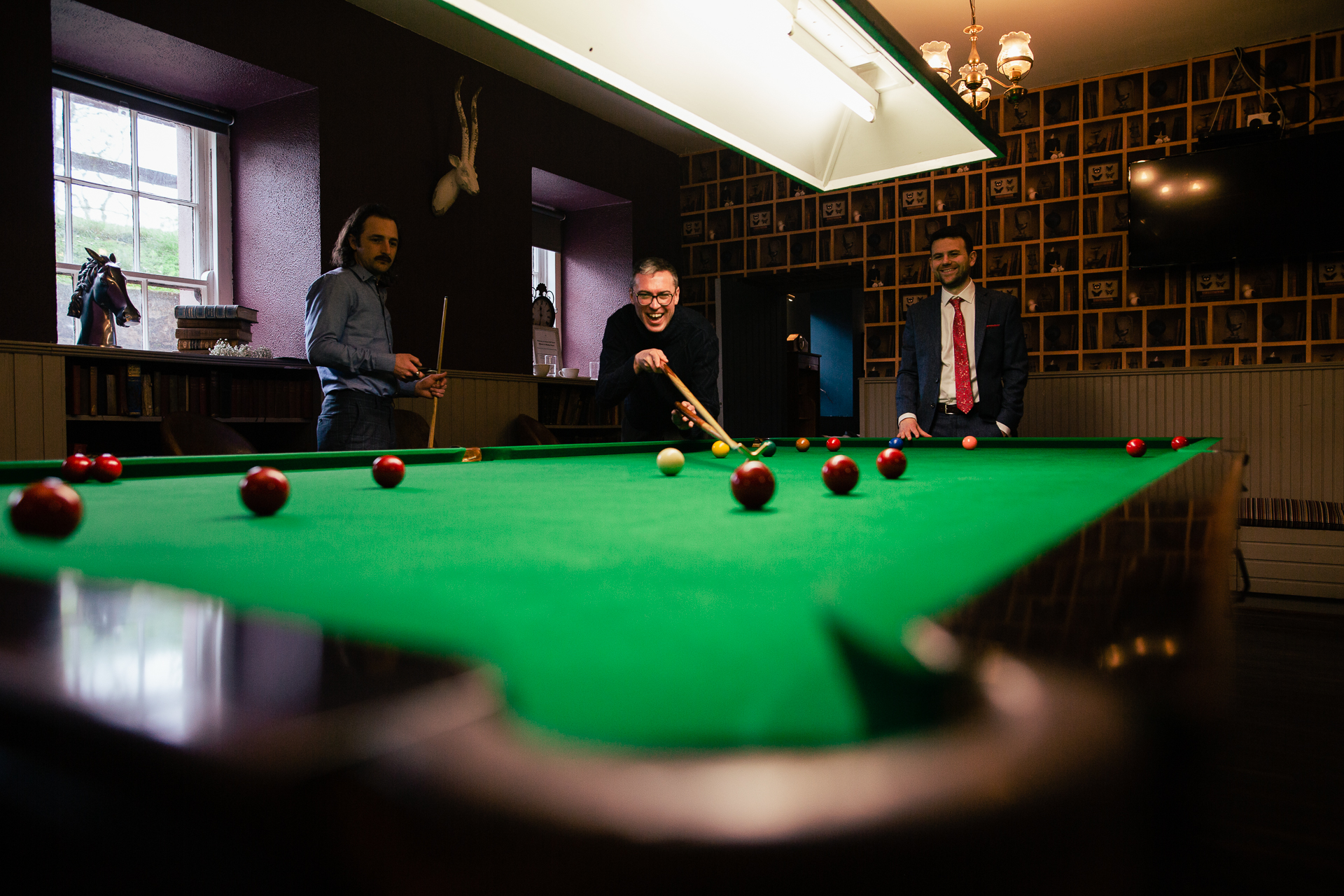 A group of men playing pool