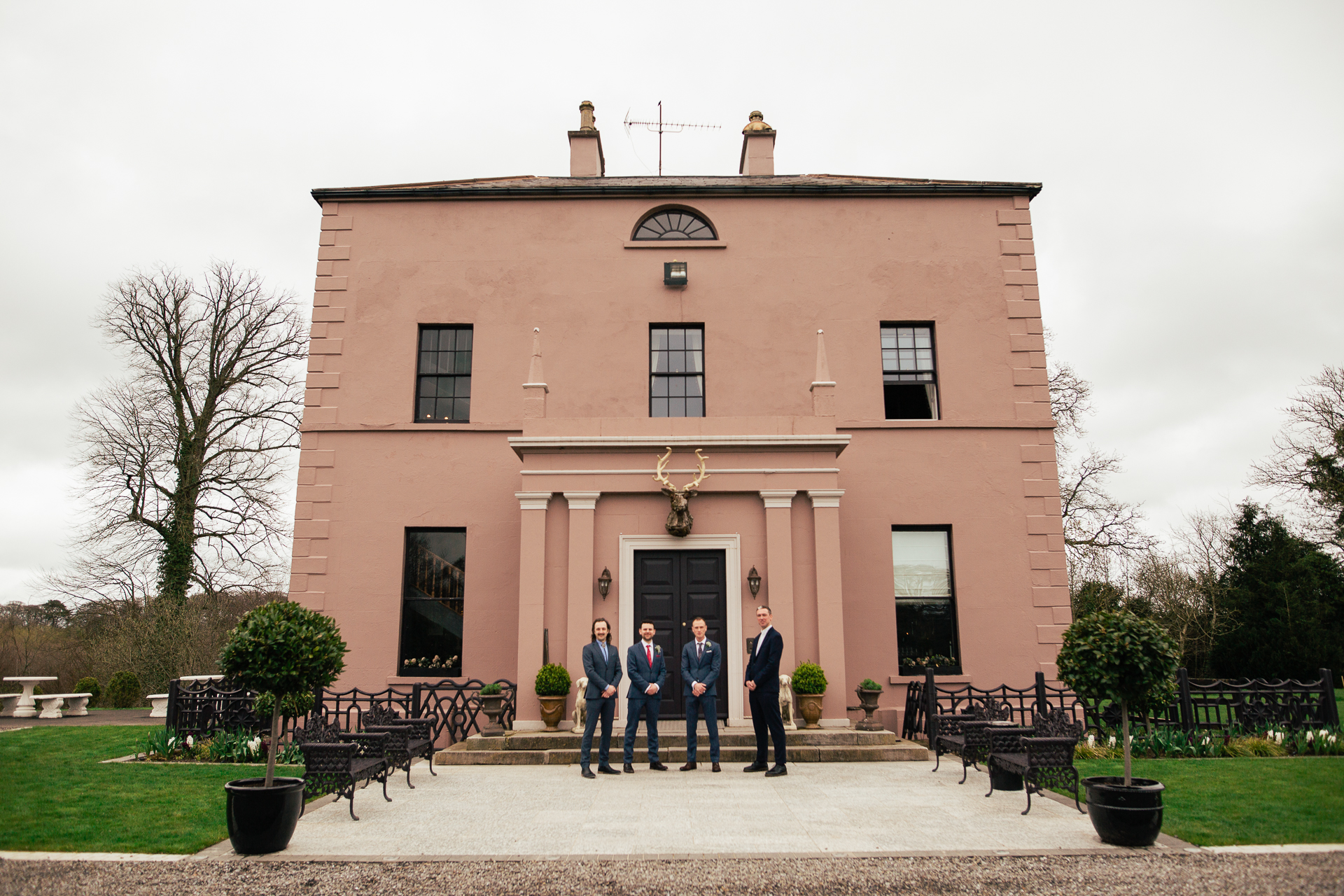 A group of people standing in front of a building