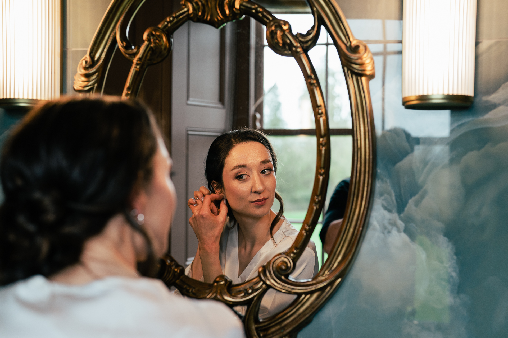 A woman looking at a mirror