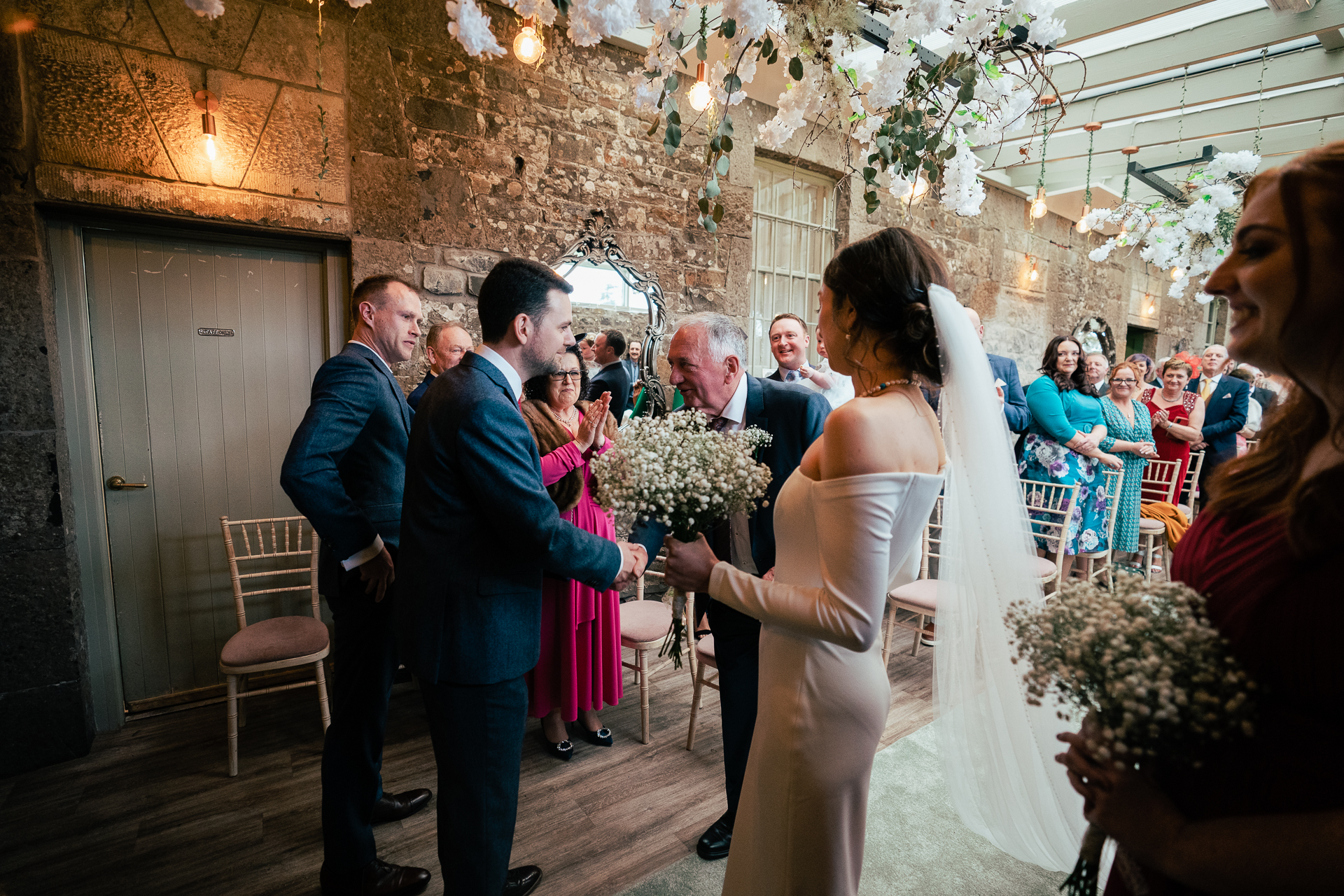 A bride and groom walking down the aisle