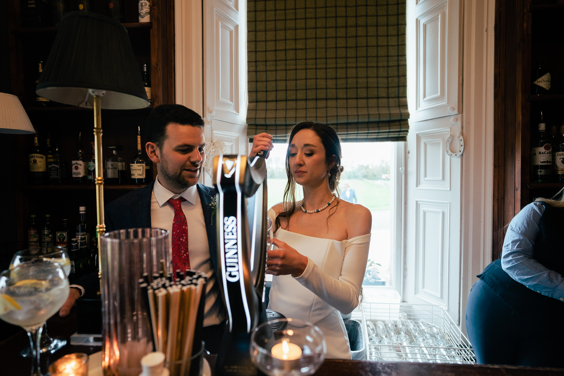 A bride and groom are cutting their wedding cake