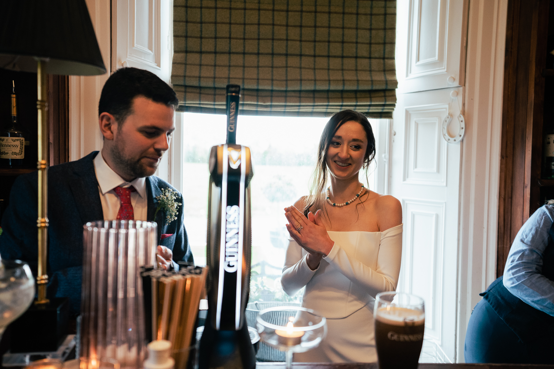 A man and woman sitting at a table with drinks