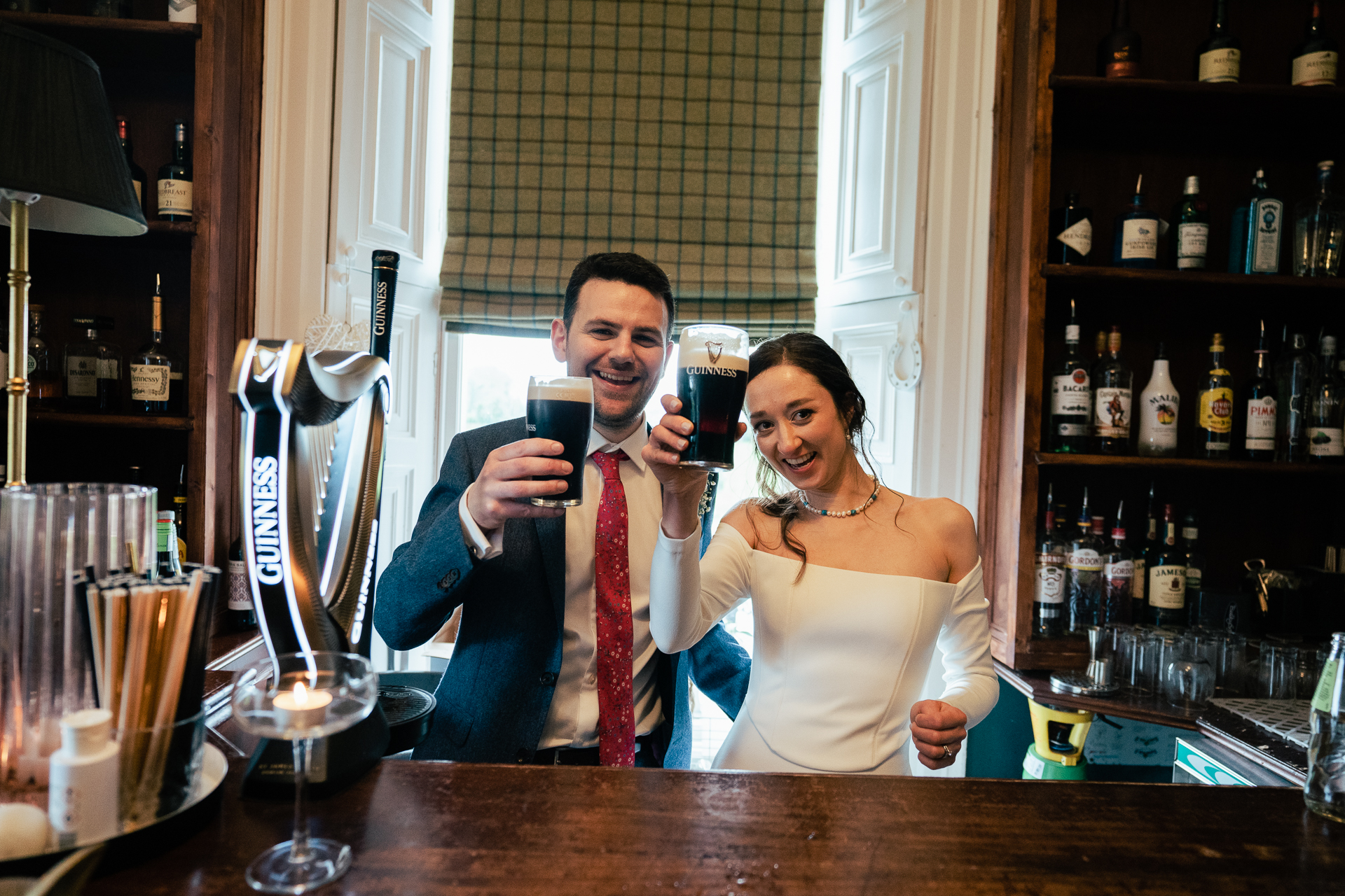 A man and woman holding glasses of wine