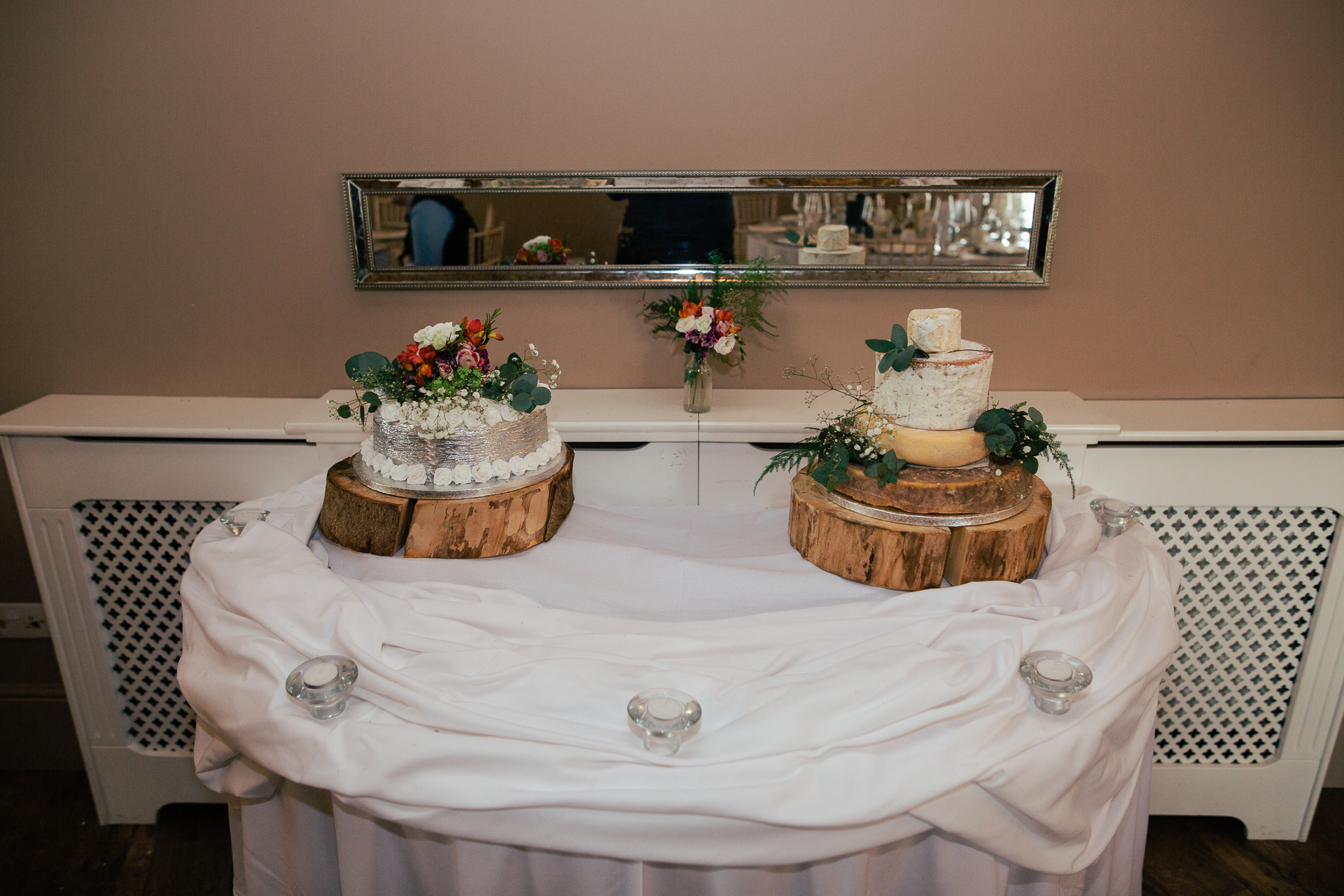 A table with a cake and flowers on it