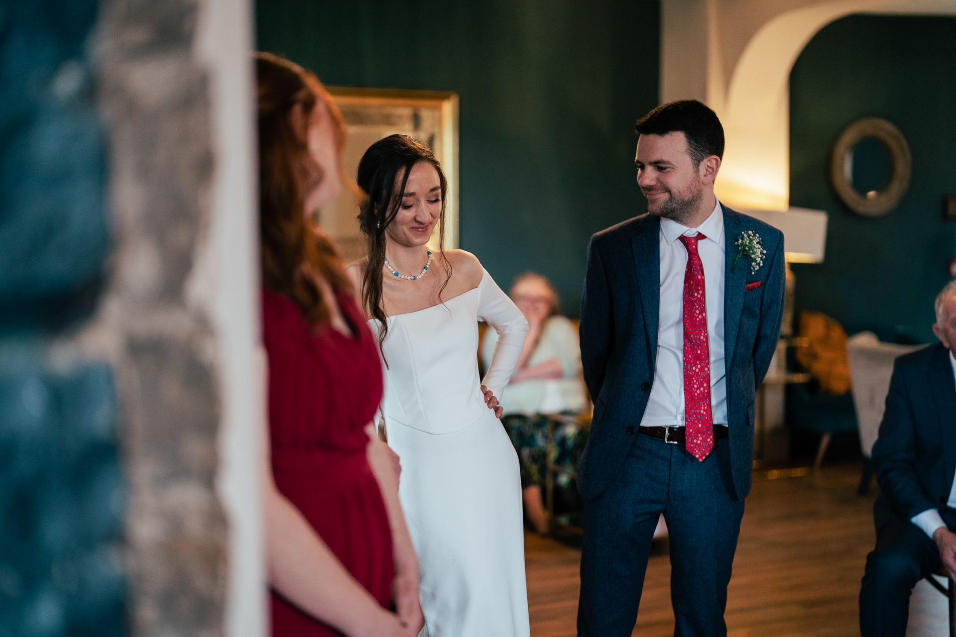 A man and woman walking down a hall