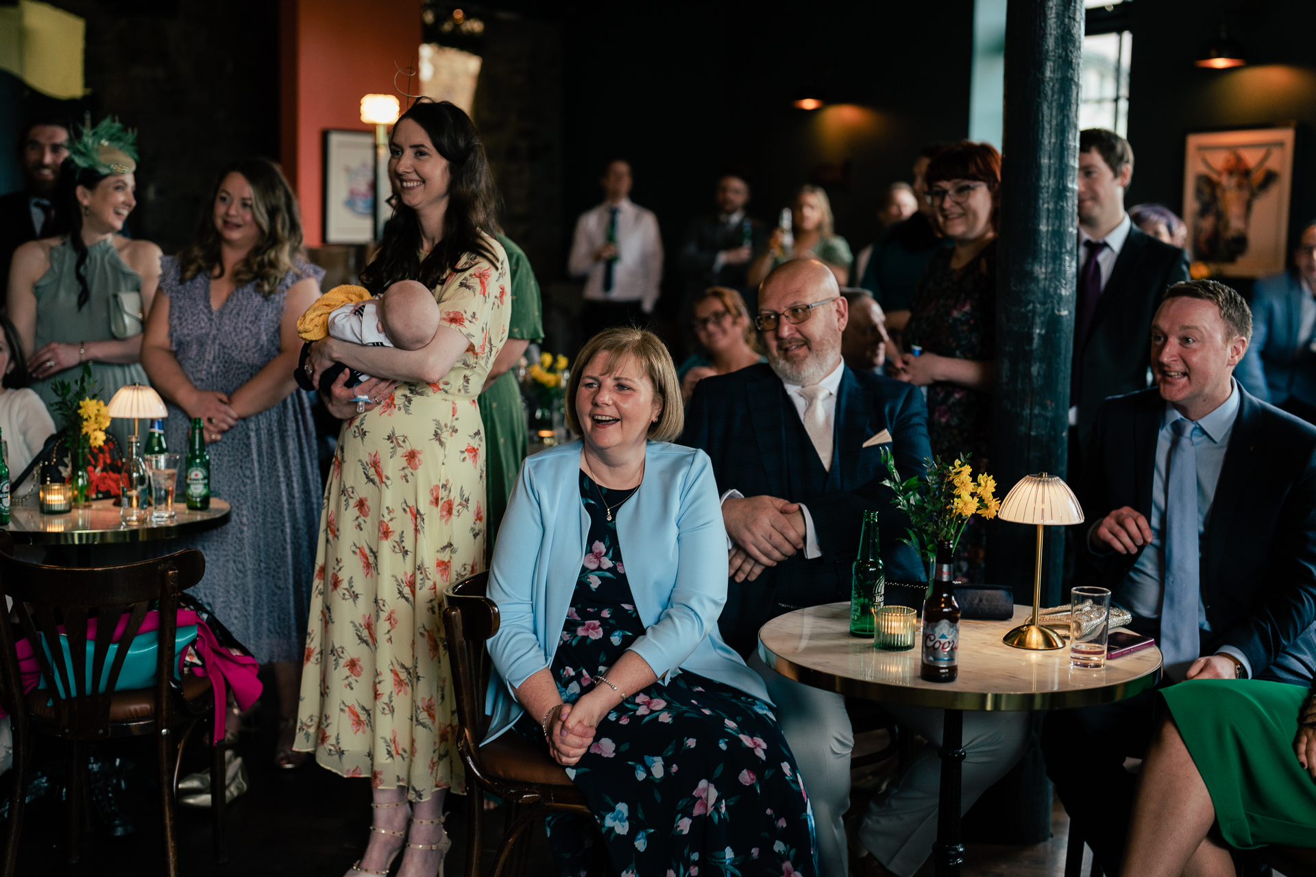 A group of people sitting at tables