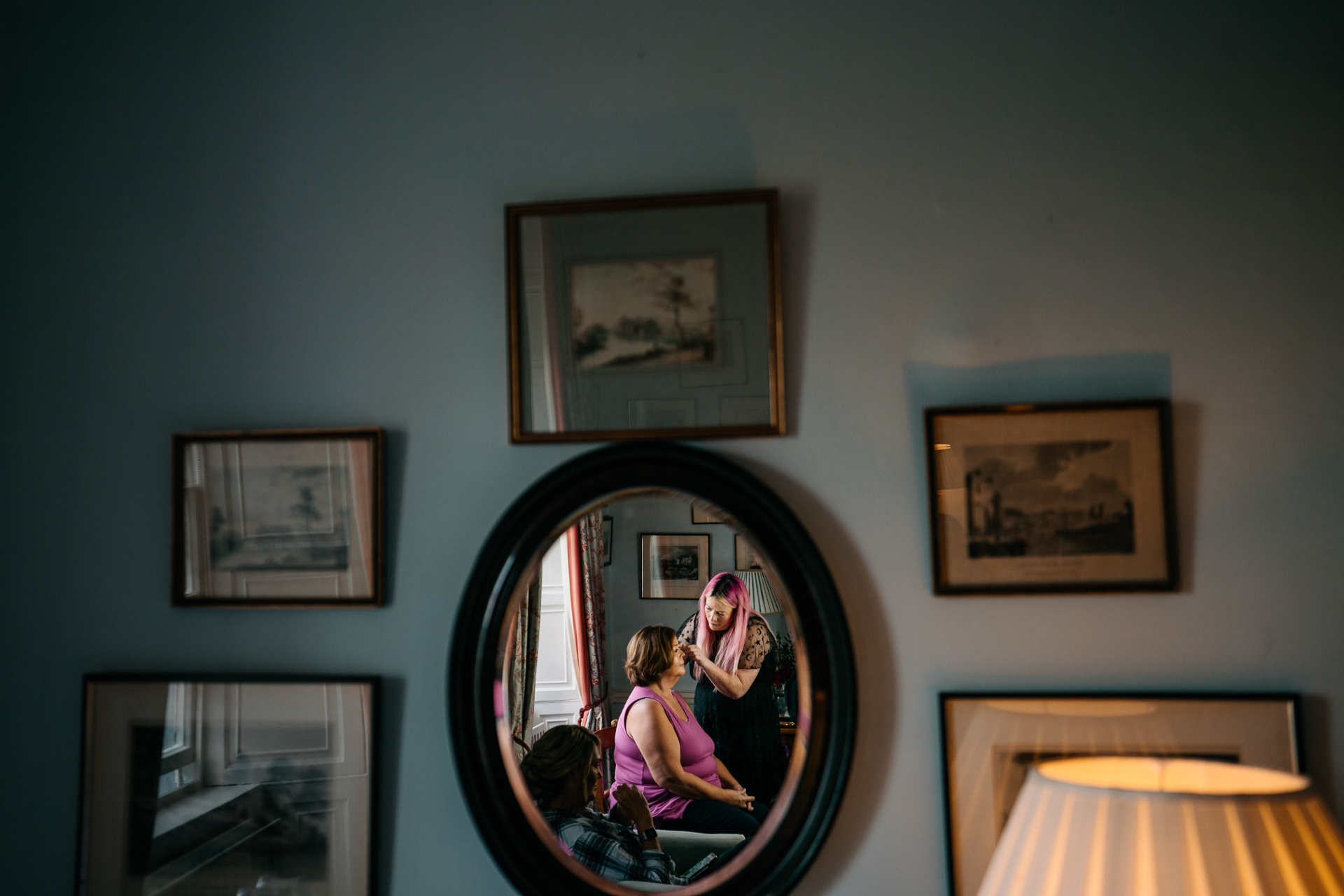 A person sitting in a mirror