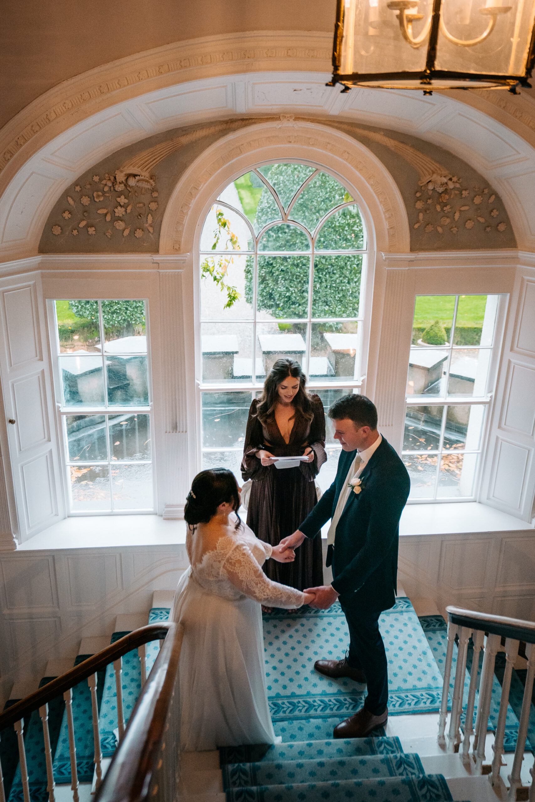 The bride preparing for her big day in the elegant bridal suite of Glin Castle, surrounded by timeless decor and natural light.