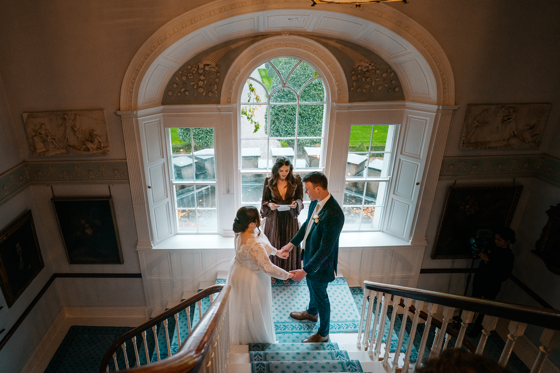 A man and woman walking down a staircase