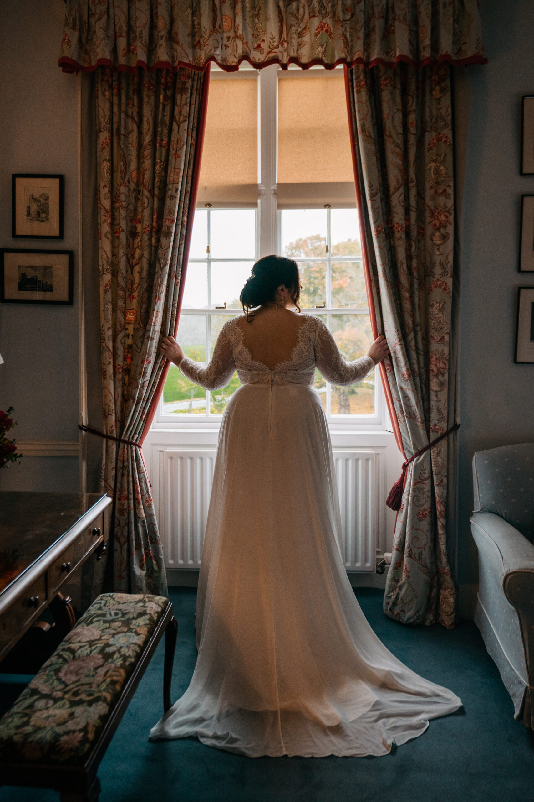 The bride preparing for her big day in the elegant bridal suite of Glin Castle, surrounded by timeless decor and natural light.