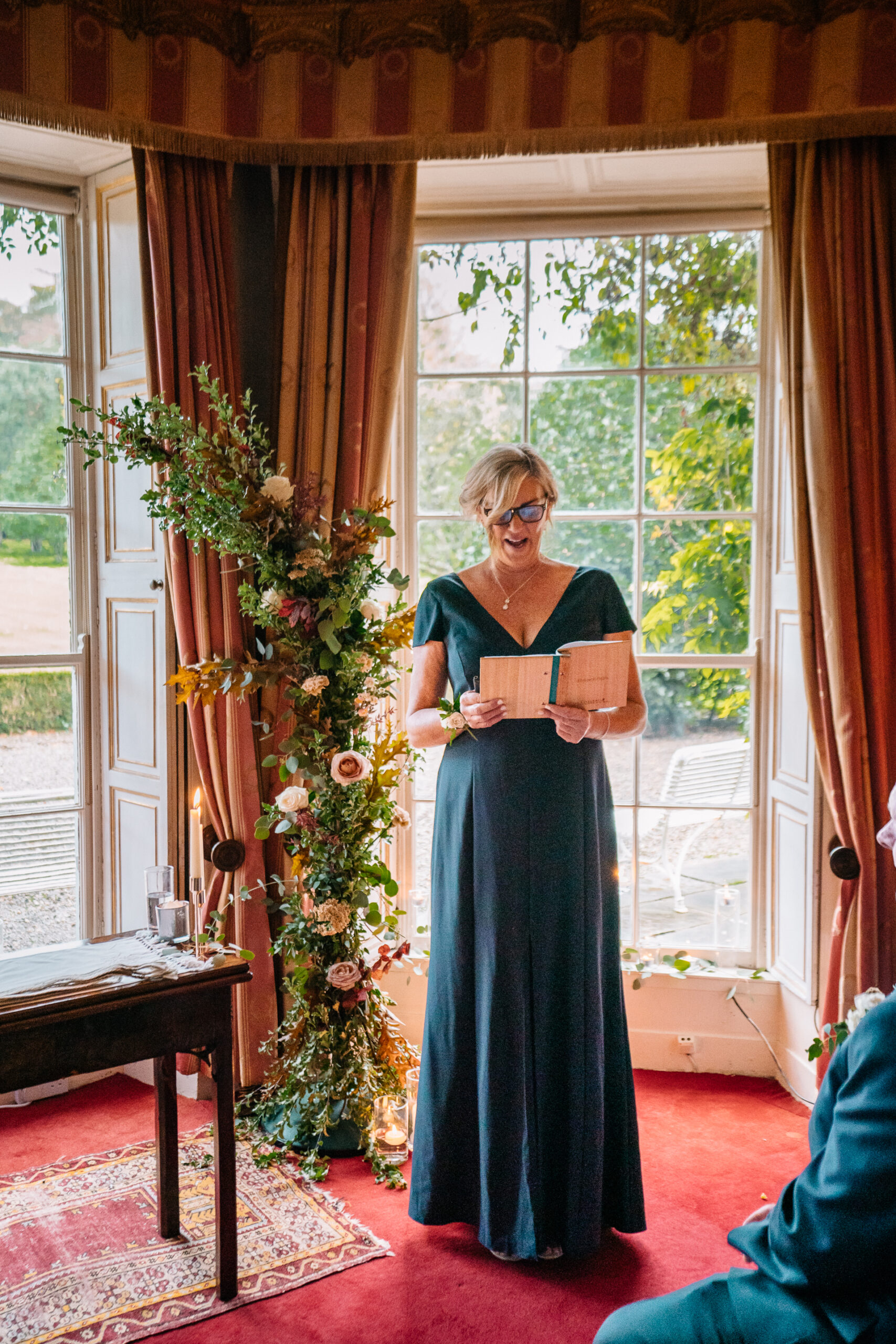 Romantic wedding ceremony set in the picturesque gardens of Glin Castle, surrounded by lush greenery and timeless elegance