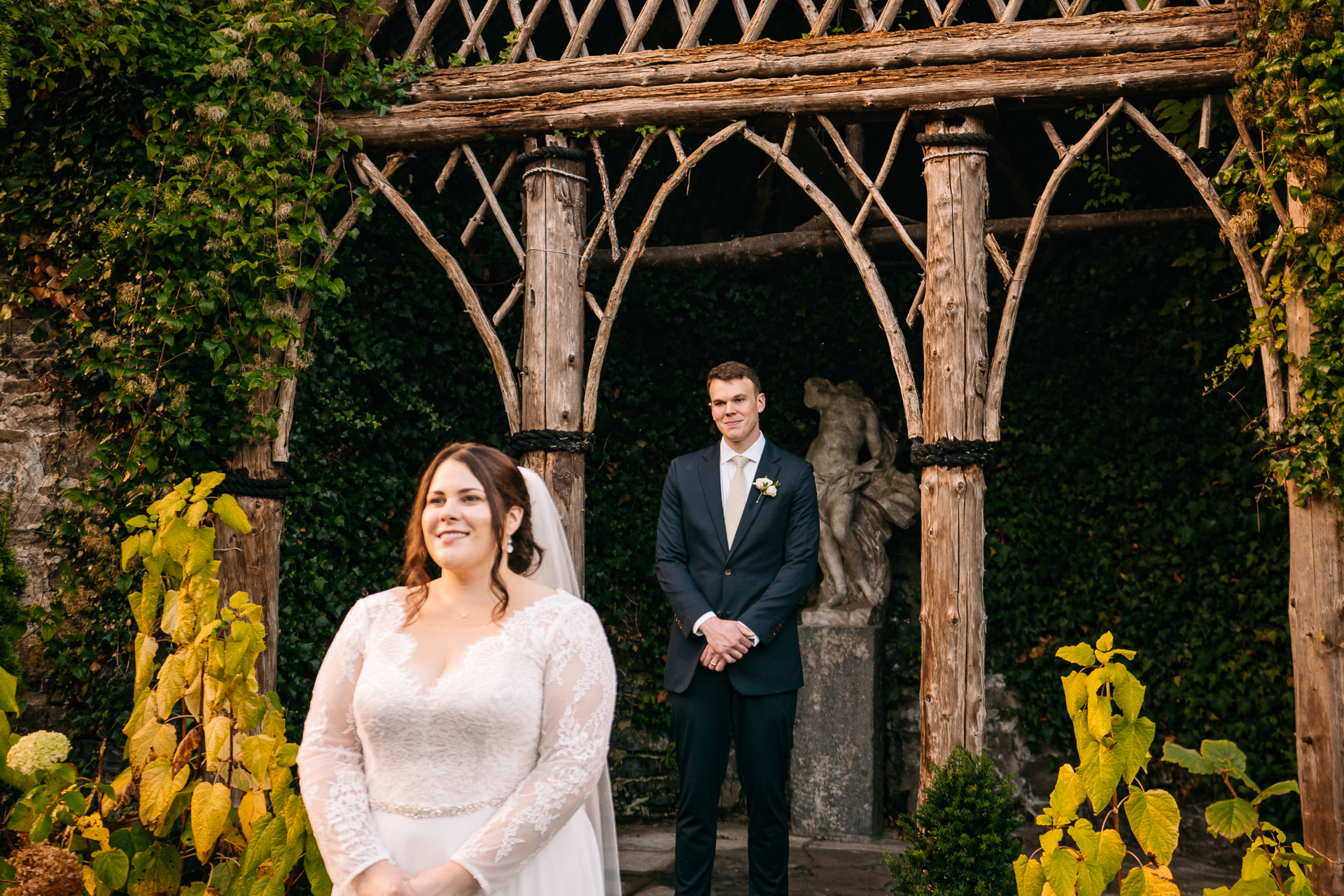 A man and woman posing for a picture in front of a gazebo