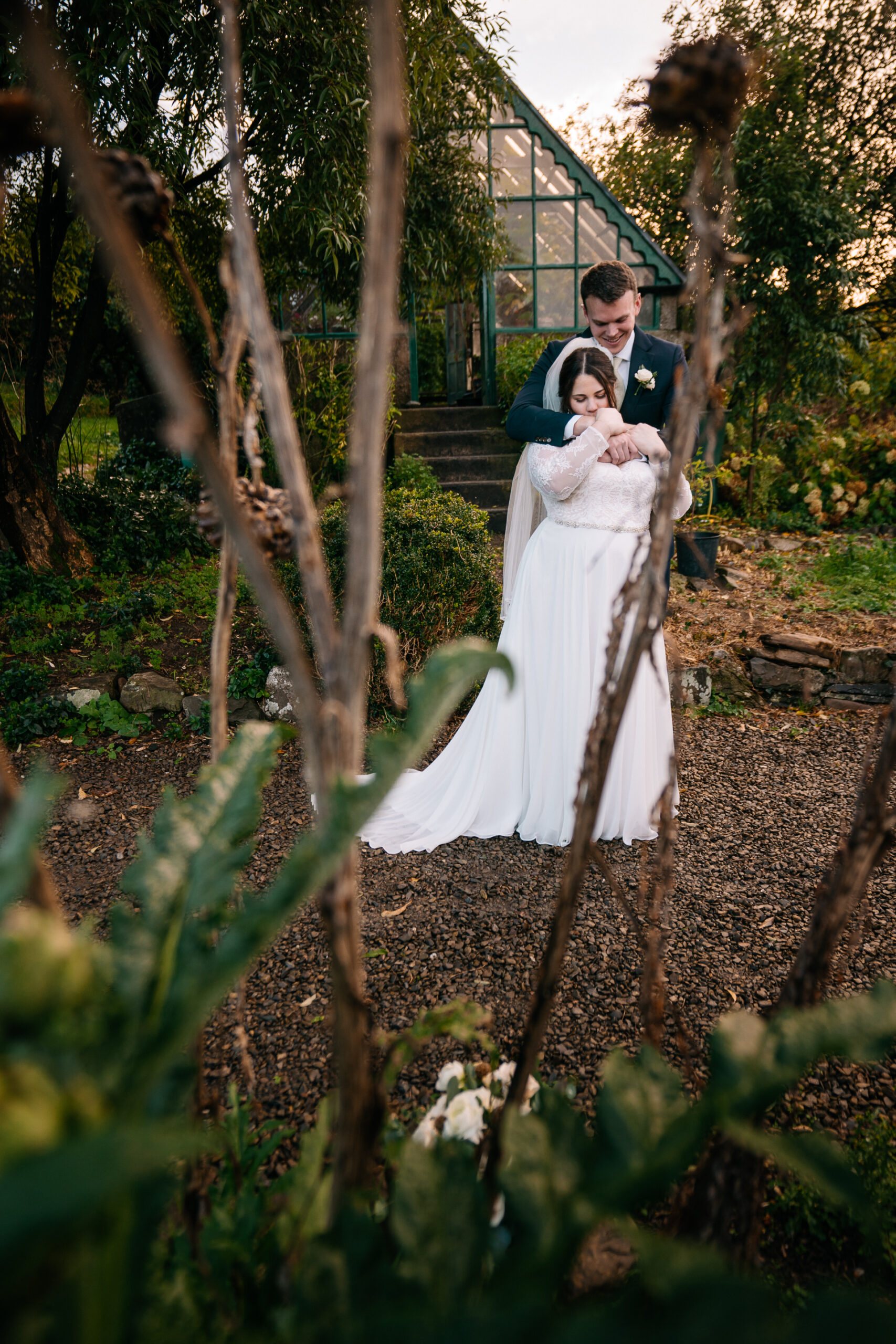 Romantic couple’s portrait session in the enchanting gardens of Glin Castle, blending natural beauty with timeless elegance