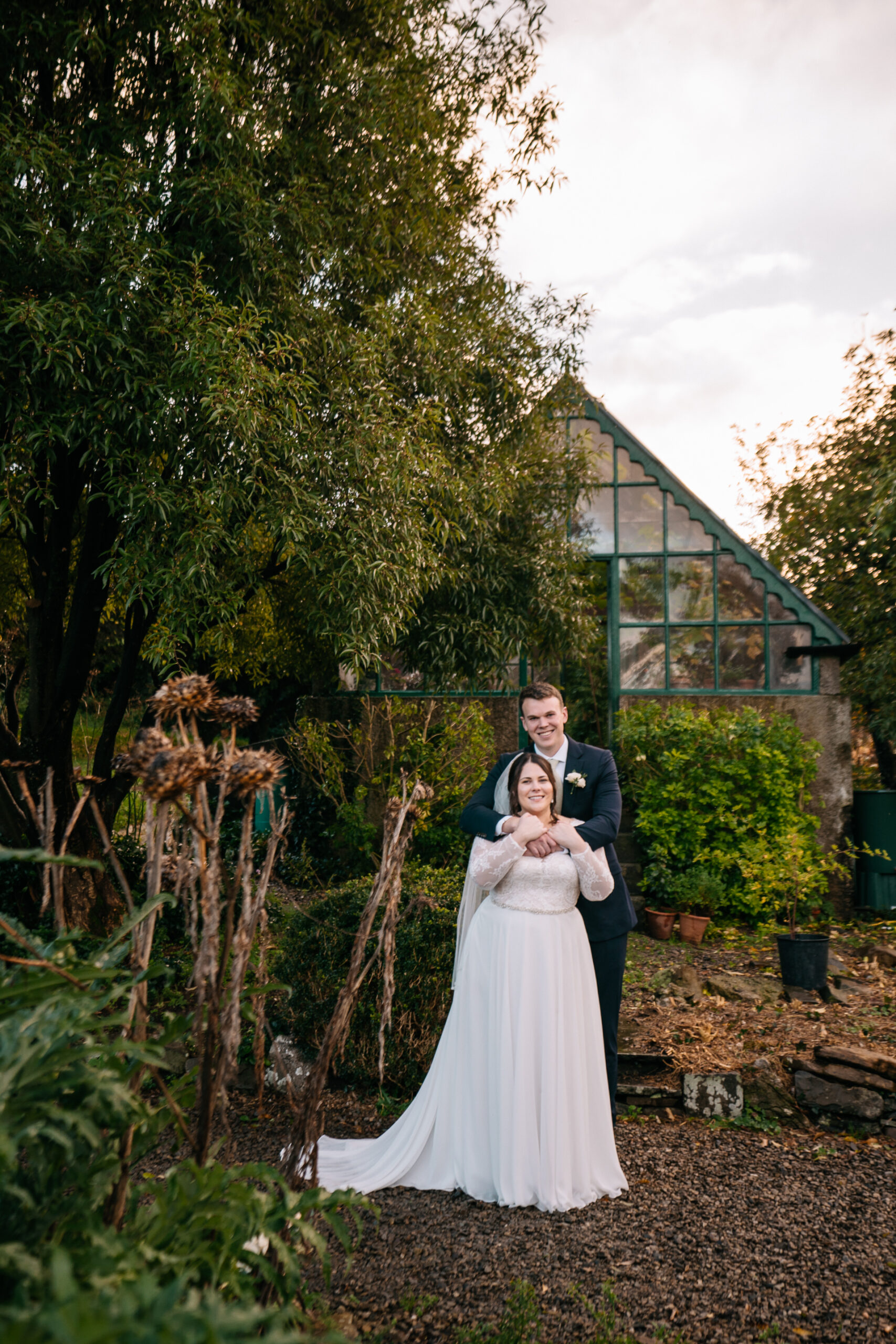 Romantic couple’s portrait session in the enchanting gardens of Glin Castle, blending natural beauty with timeless elegance