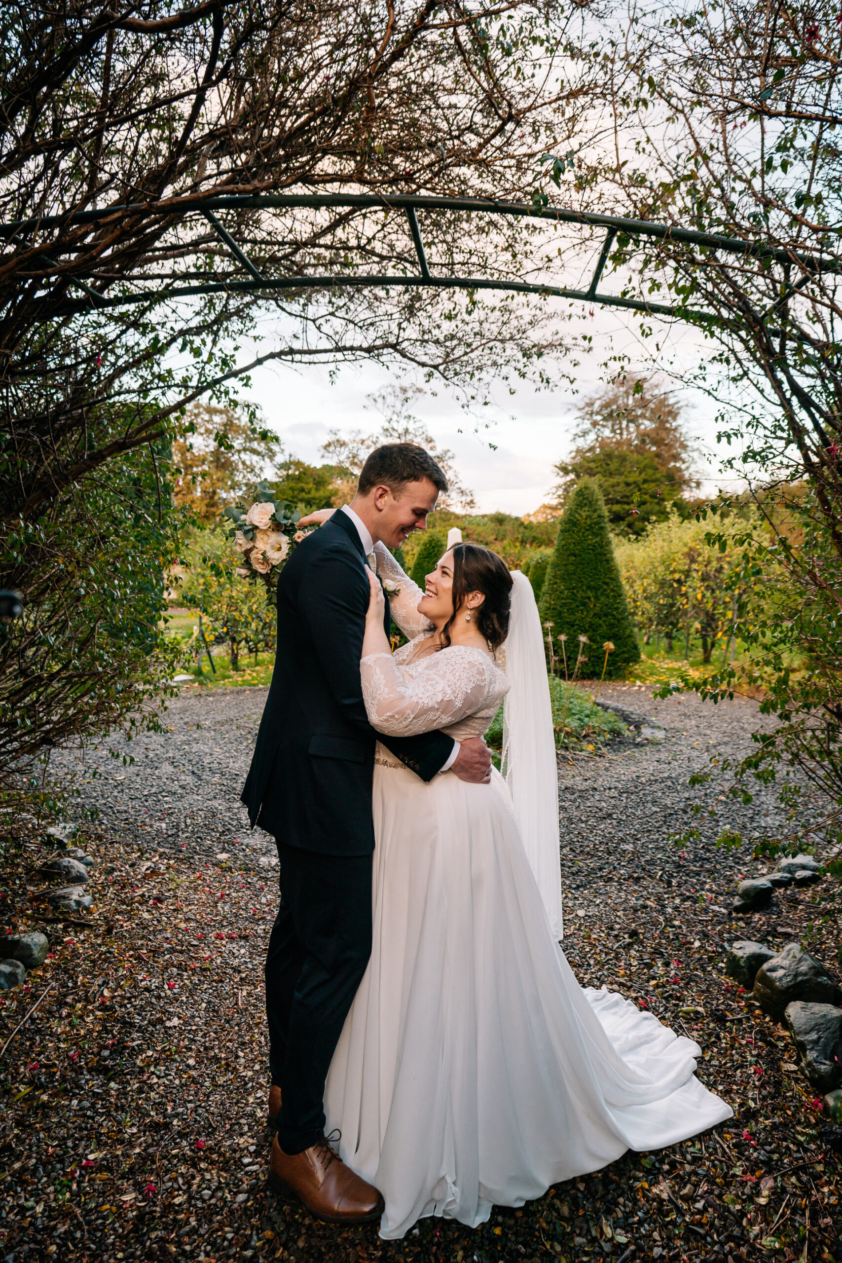 Romantic couple’s portrait session in the enchanting gardens of Glin Castle, blending natural beauty with timeless elegance