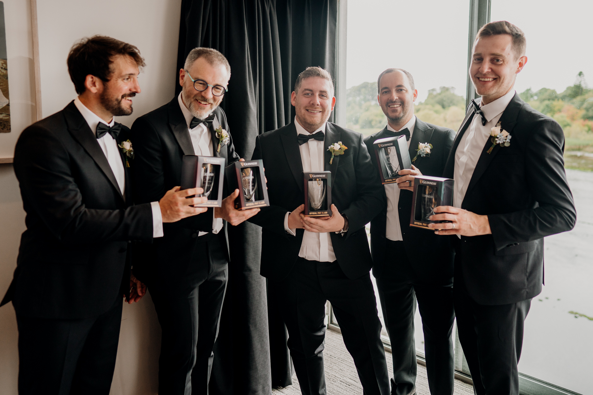 A group of men holding trophies