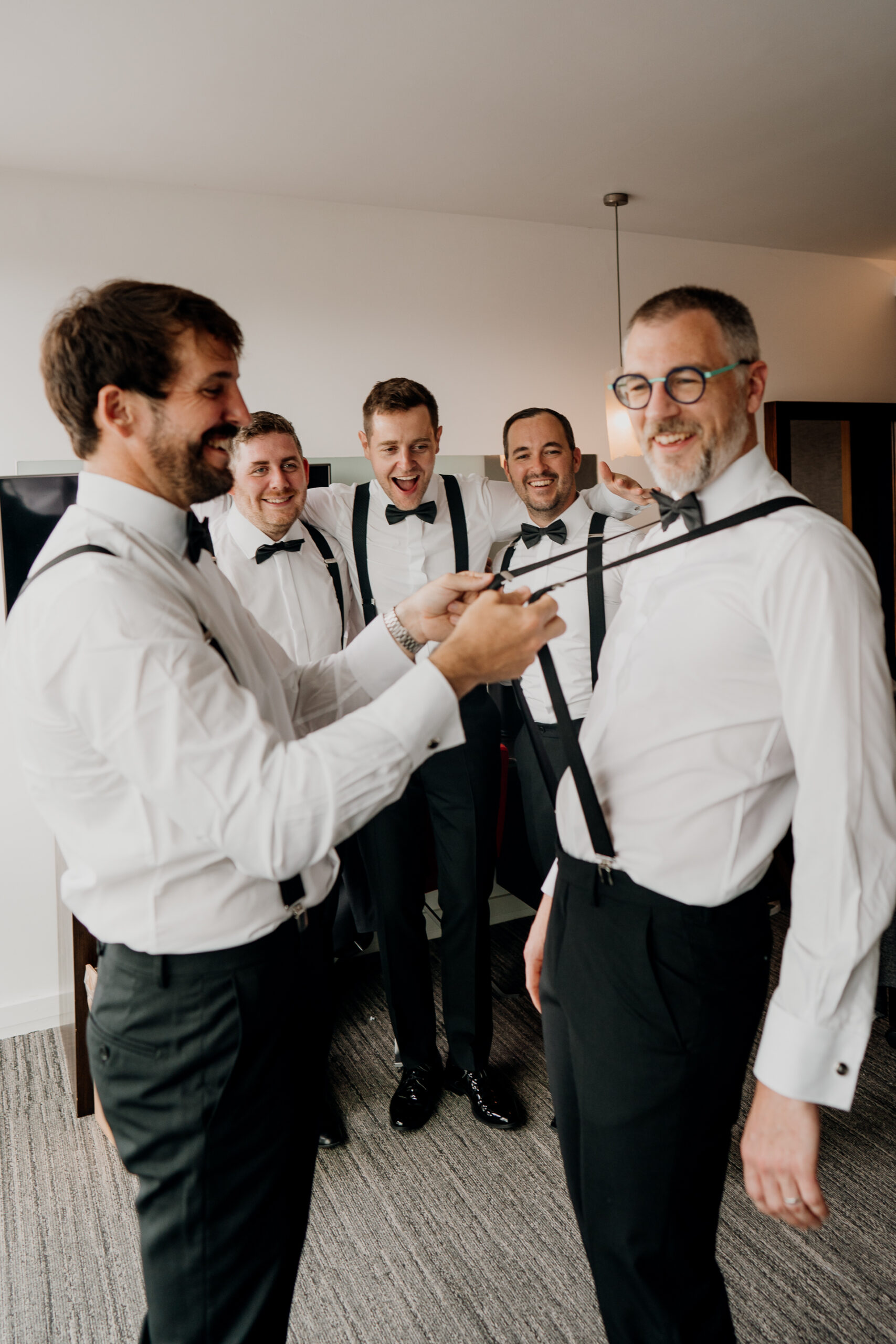 A group of men in white shirts