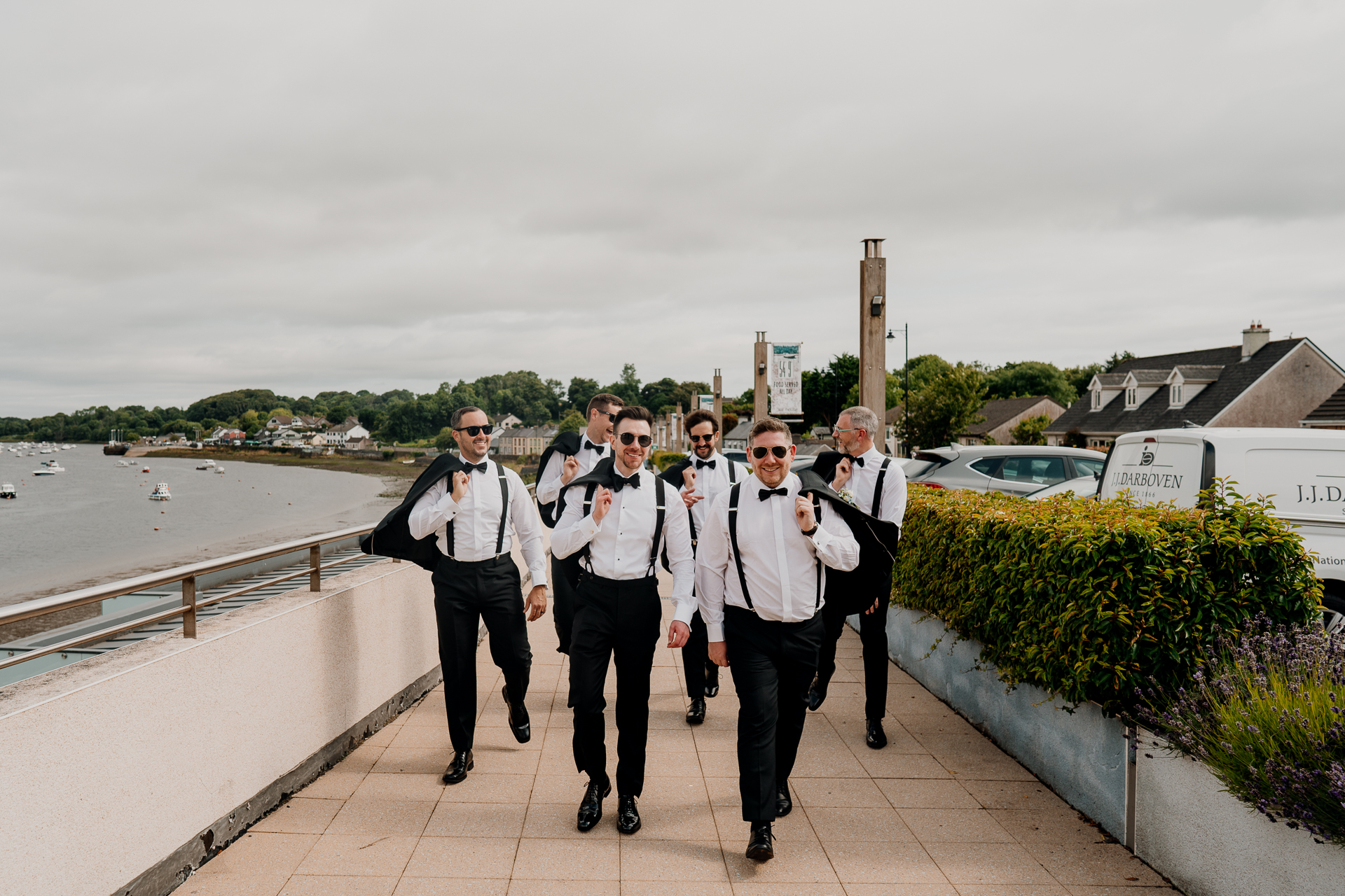 A group of people posing for a photo on a bridge