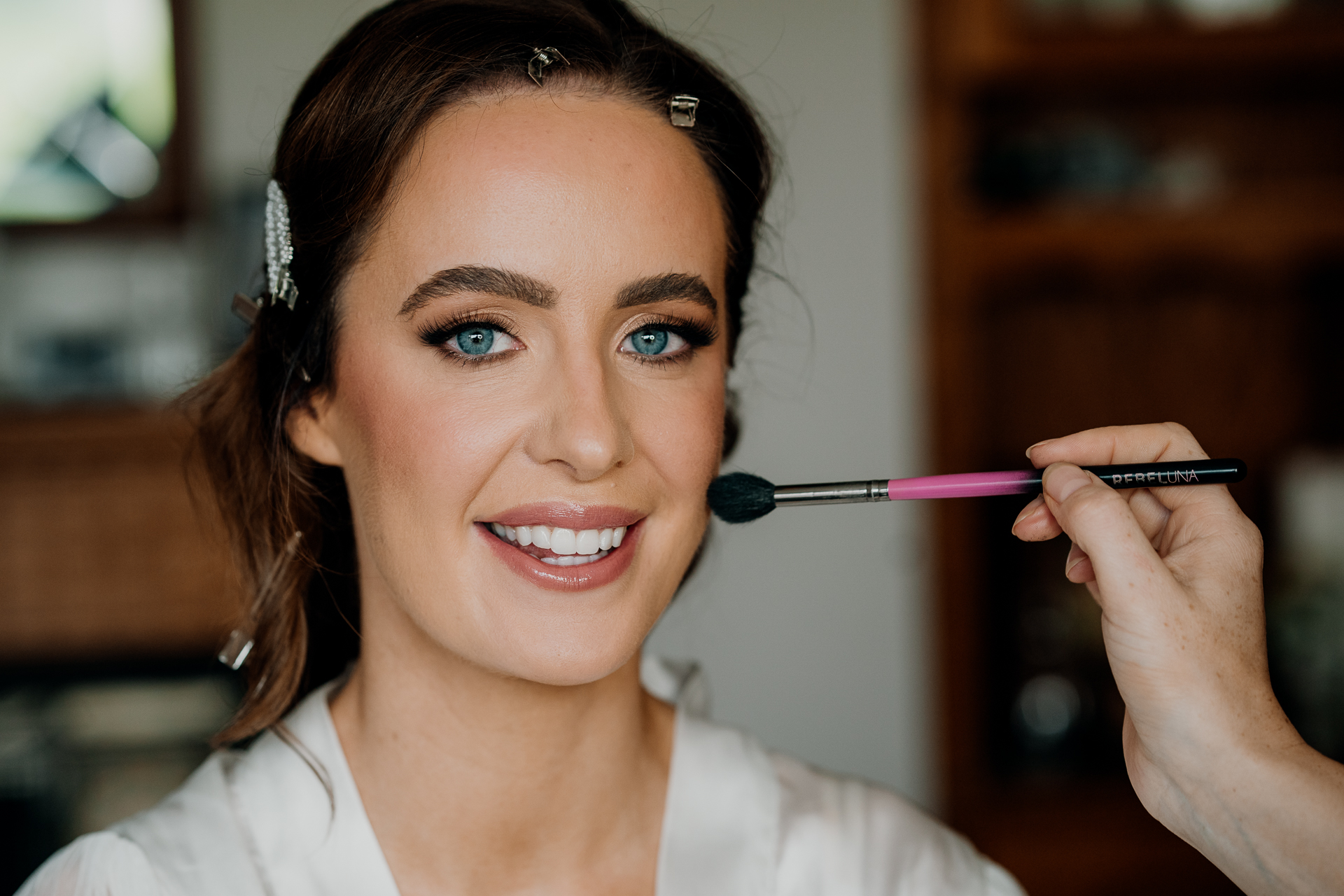 A woman with a toothbrush in her mouth