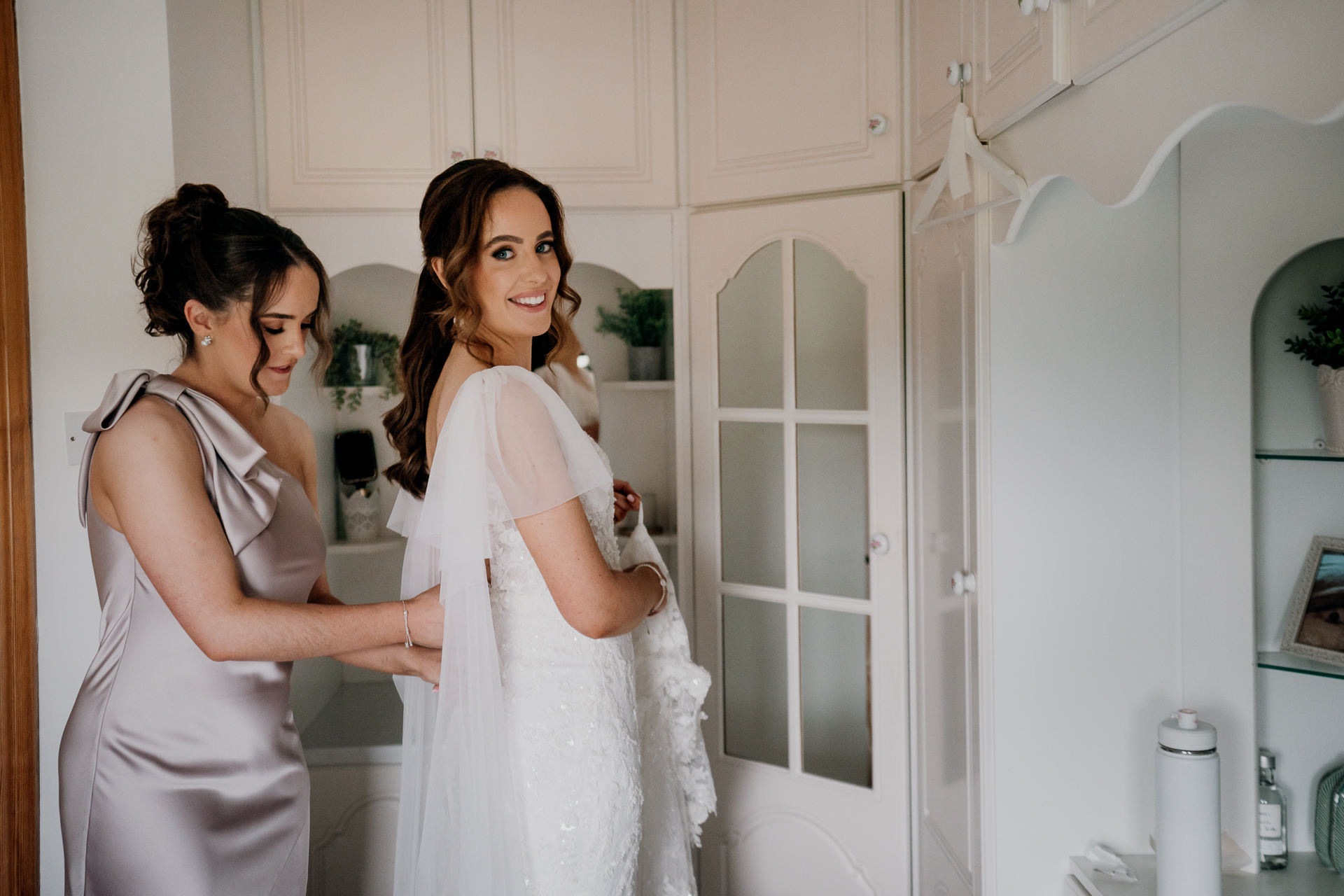 A person in a white dress and a person in a white dress