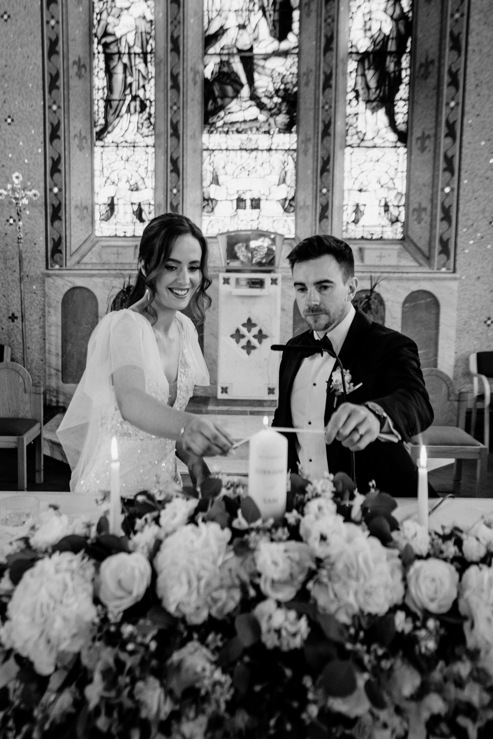 A bride and groom cutting a cake