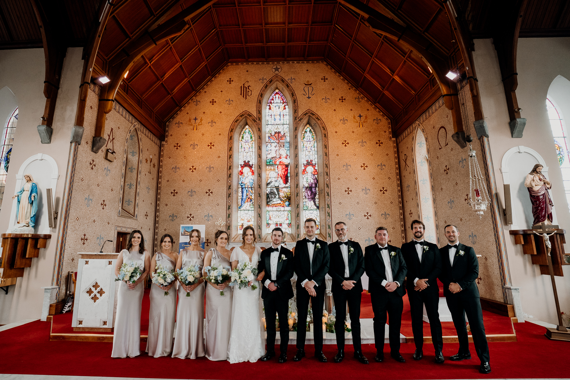 A group of people posing for a photo in a church