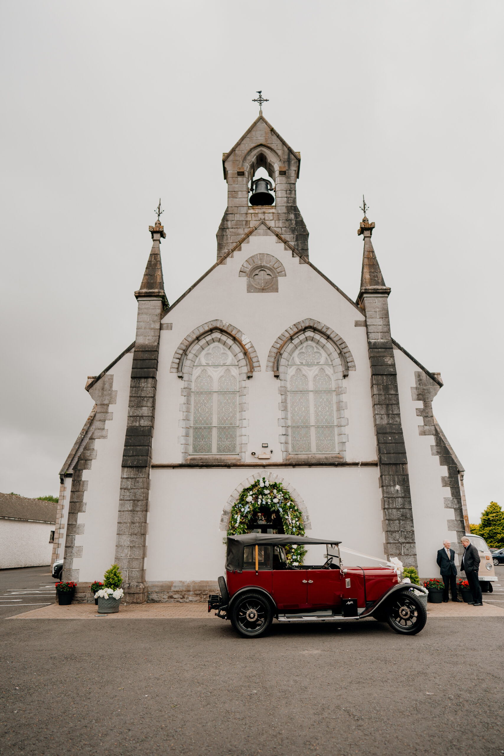 A car parked in front of a church