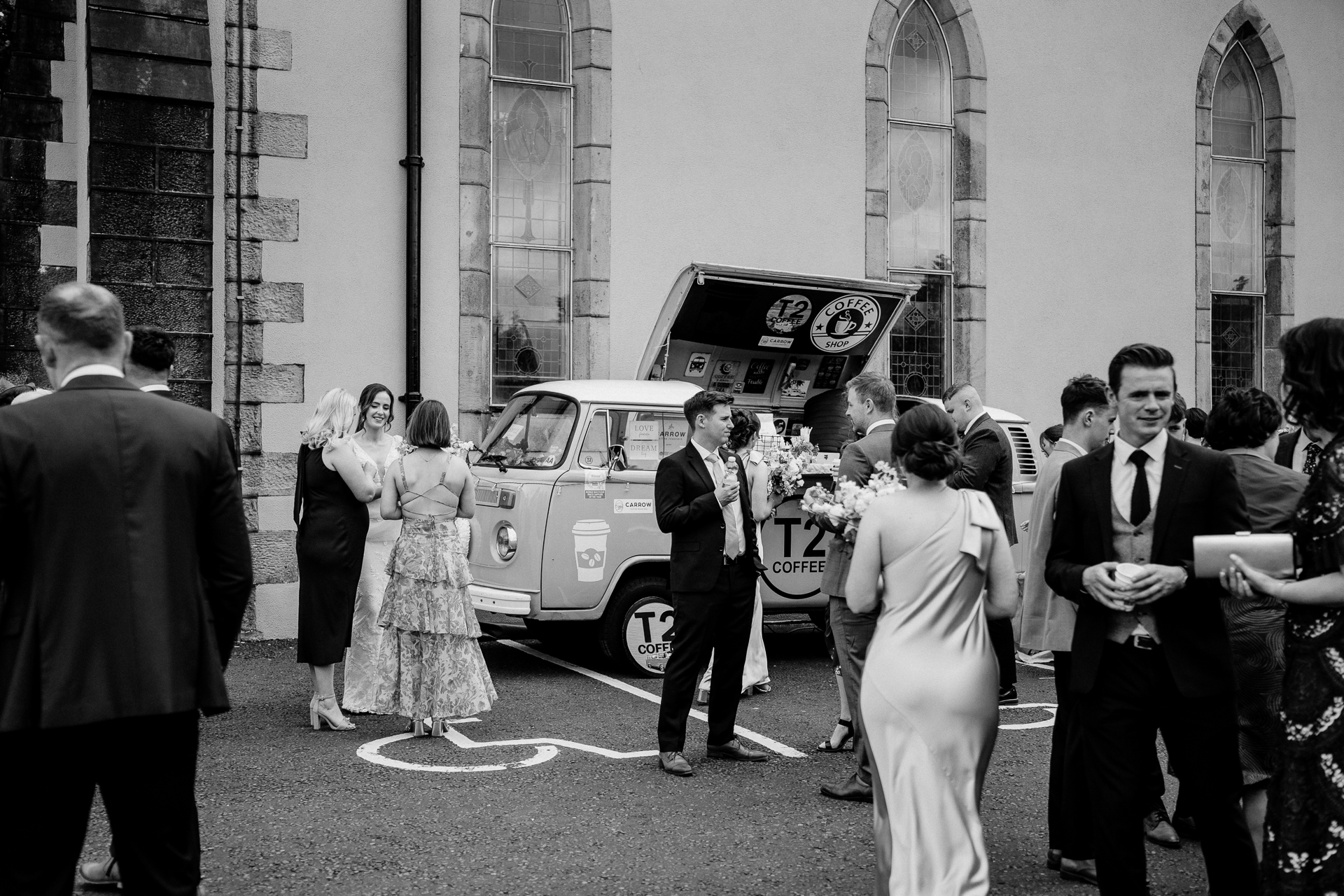 A bride and groom walking down the street