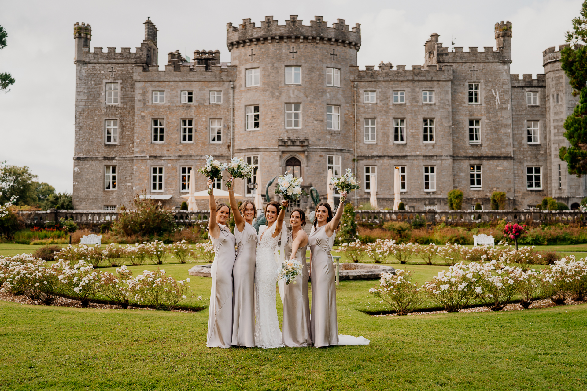 A group of women in front of a large building