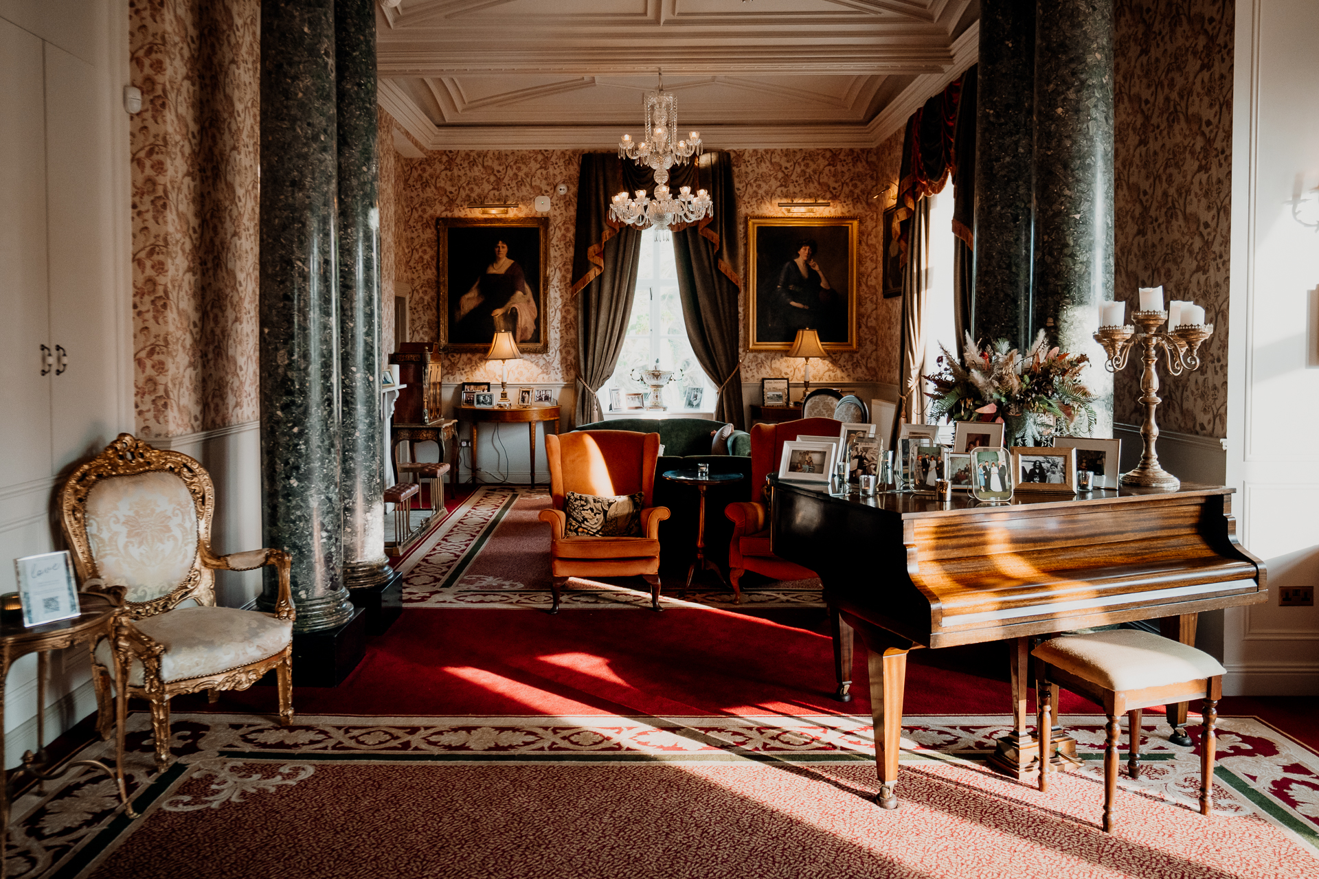 A room with a piano and chairs