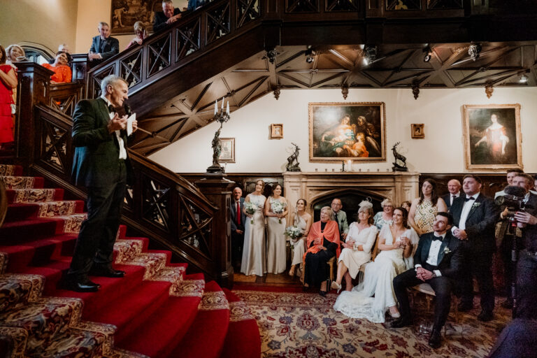 Elegant Markree Castle interior with winter wedding decorations and a cozy fireplace.  