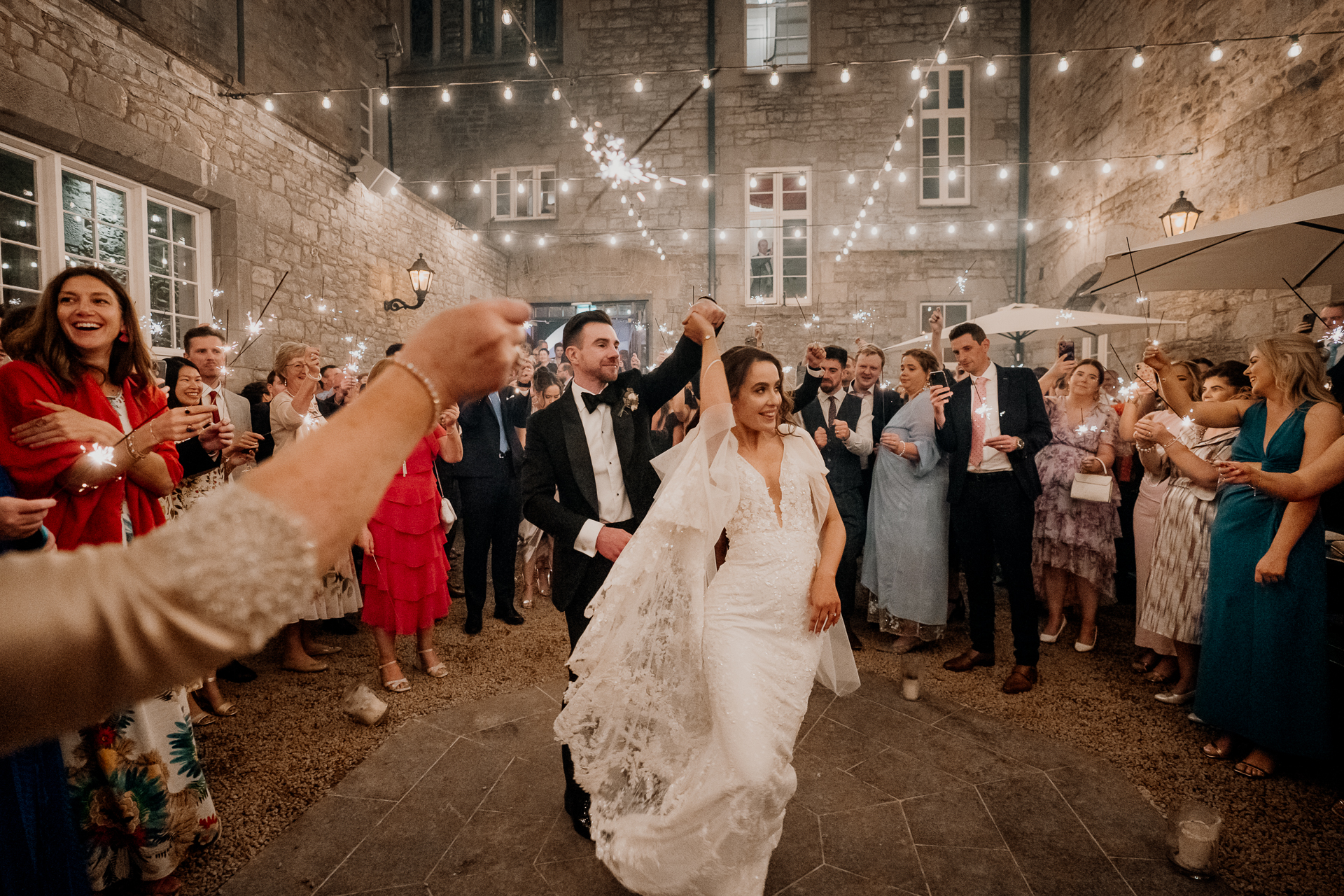 A man and woman dancing in front of a crowd of people