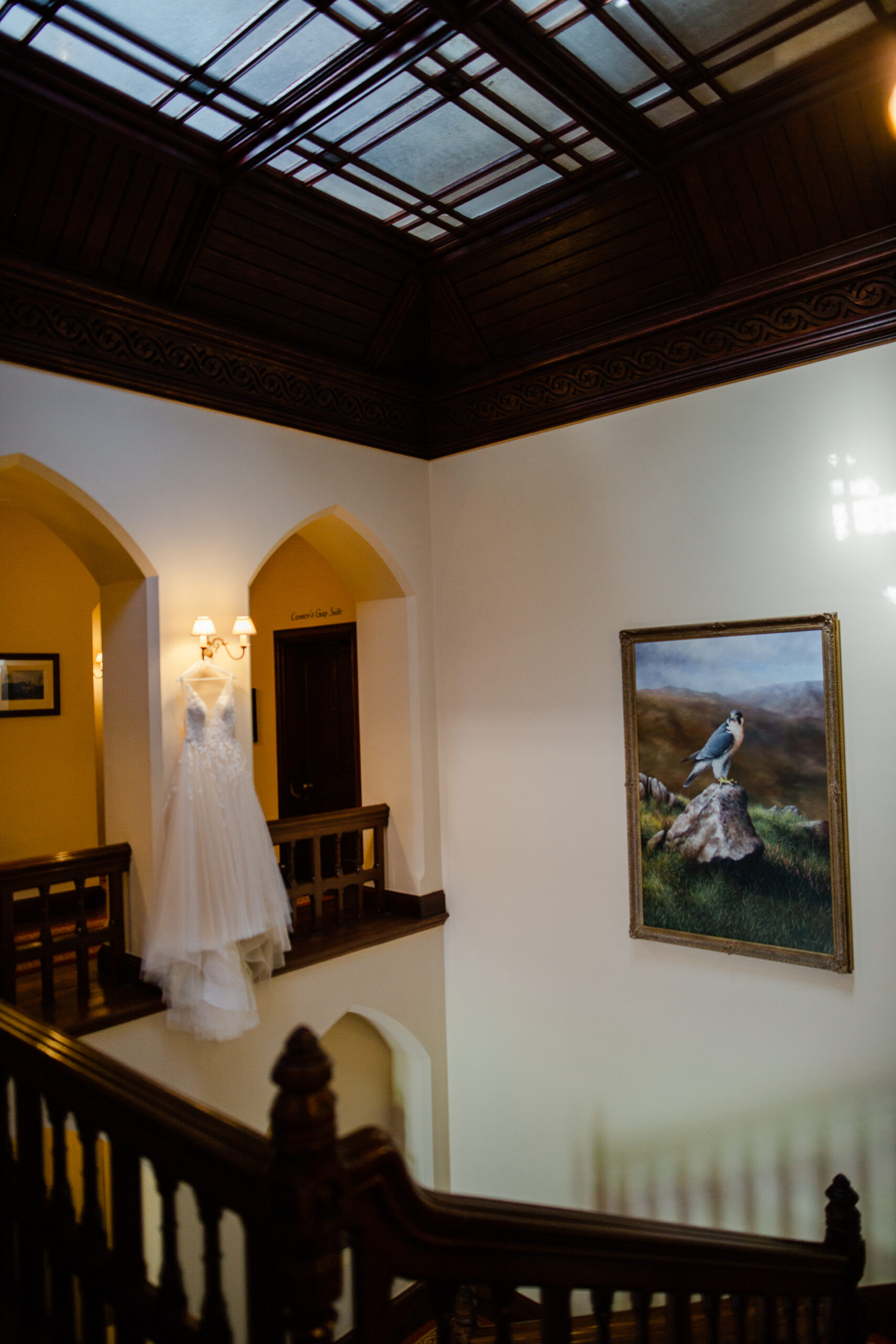 A bride and groom walking down the stairs