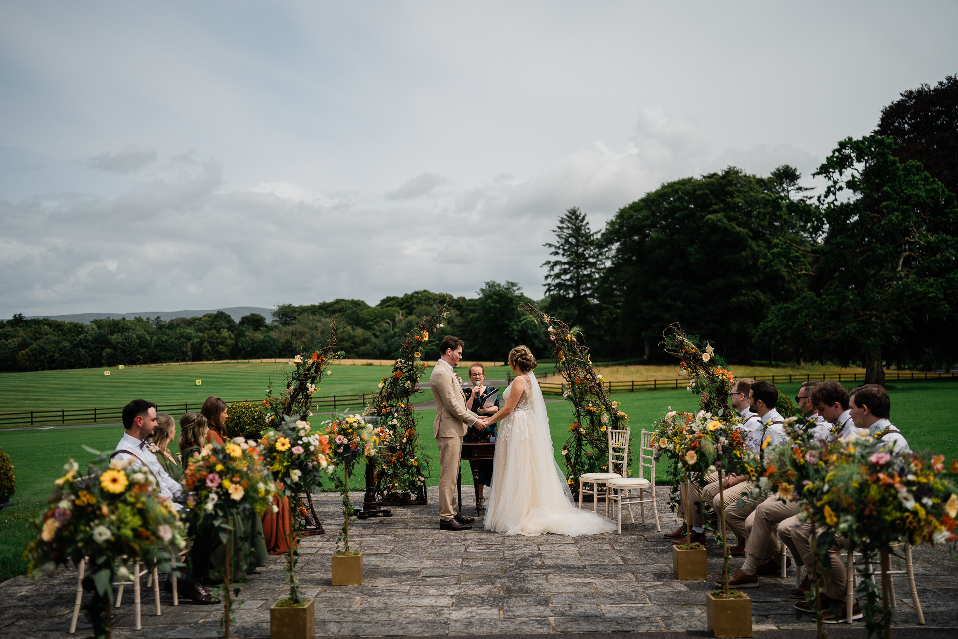 A bride and groom walking down a aisle in a wedding ceremony